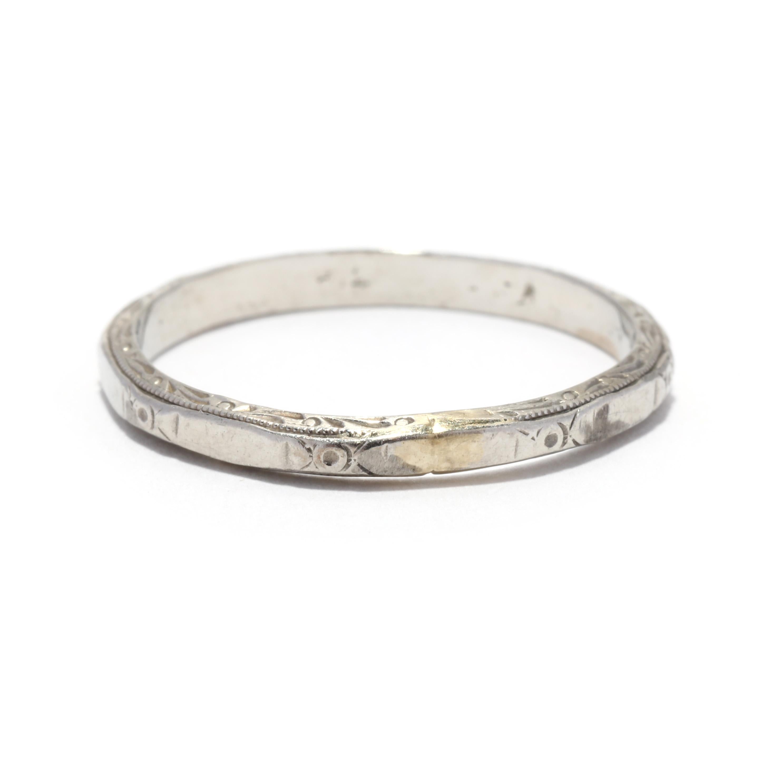 An Art Deco 18 karat white gold engraved wedding band. This stackable band features alternating floral engraved stations with polished plain stations in an eternity design. Please note that there is evidence of sizing.

Ring Size 7.75

Width: 2.3