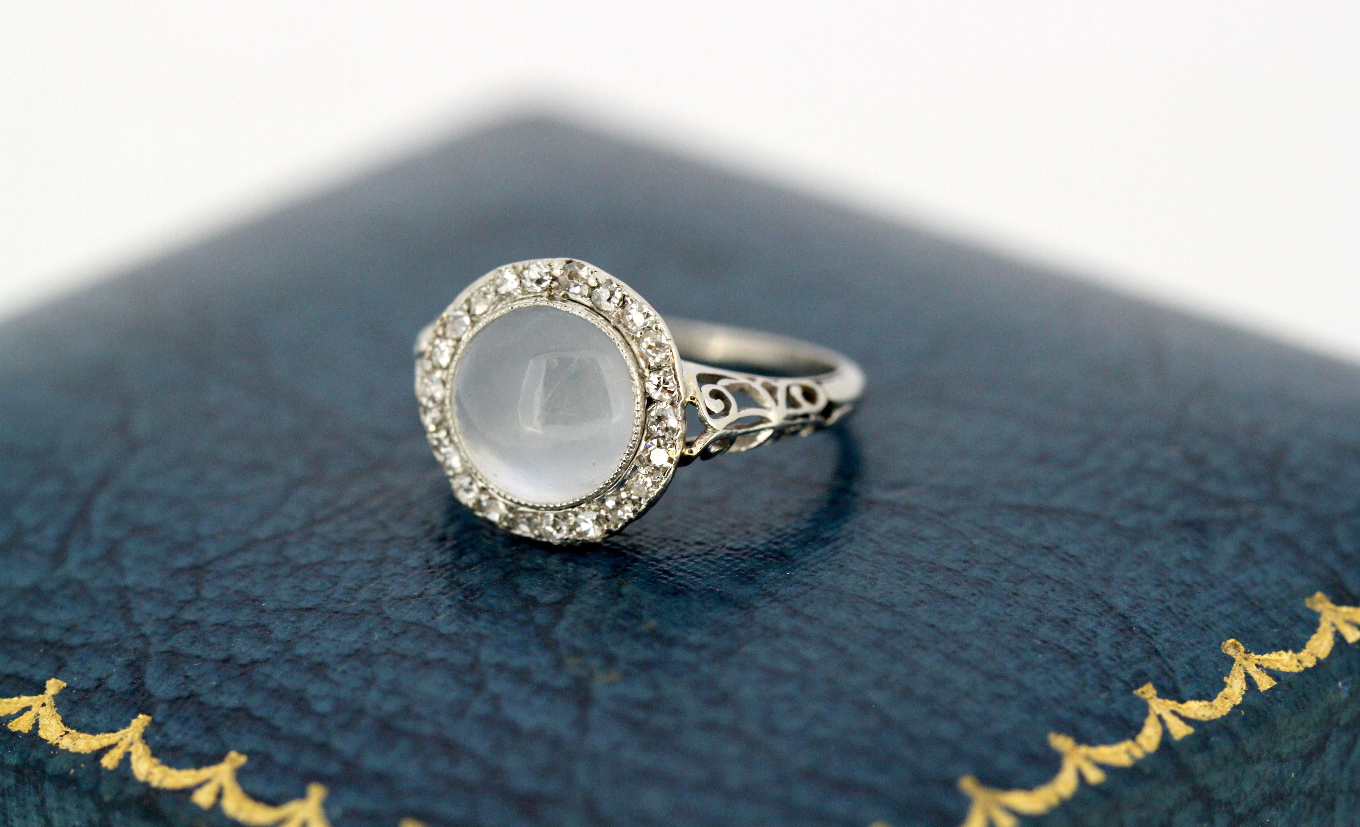 Antique Art deco 18kt white gold ladies ring with natural moonstone and diamonds.
Made in France Circa 1910.
Hallmarked with eagles head, French for 18kt gold.

Dimensions -
Size: (UK) = L (US) = 6 (EU) = 51 1/2
Weight: 4 g
Ring Size : 2.4 x 2 x 1.3