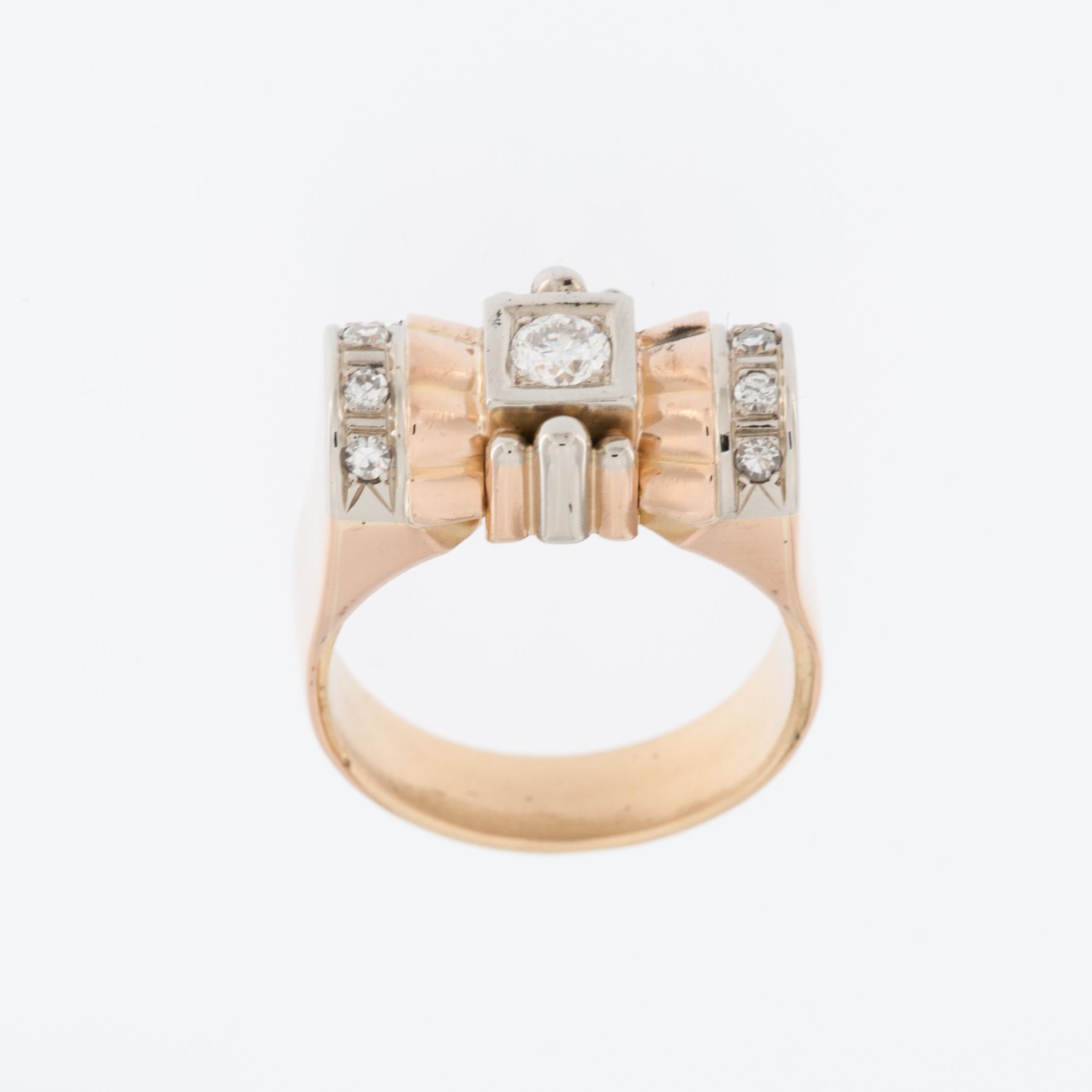 The Art Deco 18kt Yellow and White Gold Hand-Chiselled Ring is an exquisite piece of jewelry. 
With its combination of yellow and white gold, it exhibits a captivating contrast. The hand-chiselled details add a touch of craftsmanship and uniqueness