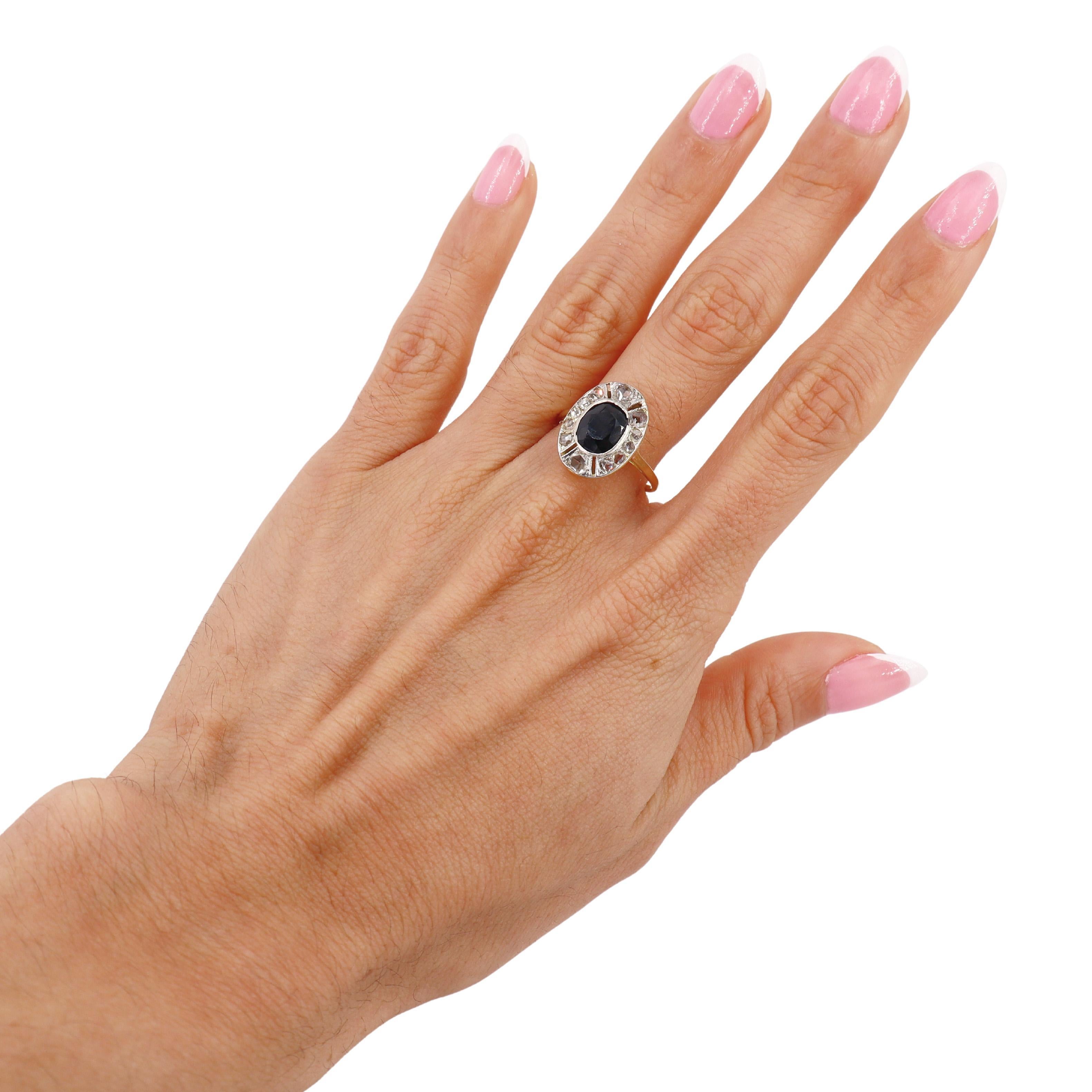 This exquisite Art Deco Ring, circa 1910-1920, beautifully embodies the elegance and geometric artistry of the era. Expertly crafted in 18kt yellow gold with a platinum overlay, the ring is adorned with fine milgrain edges, adding a touch of