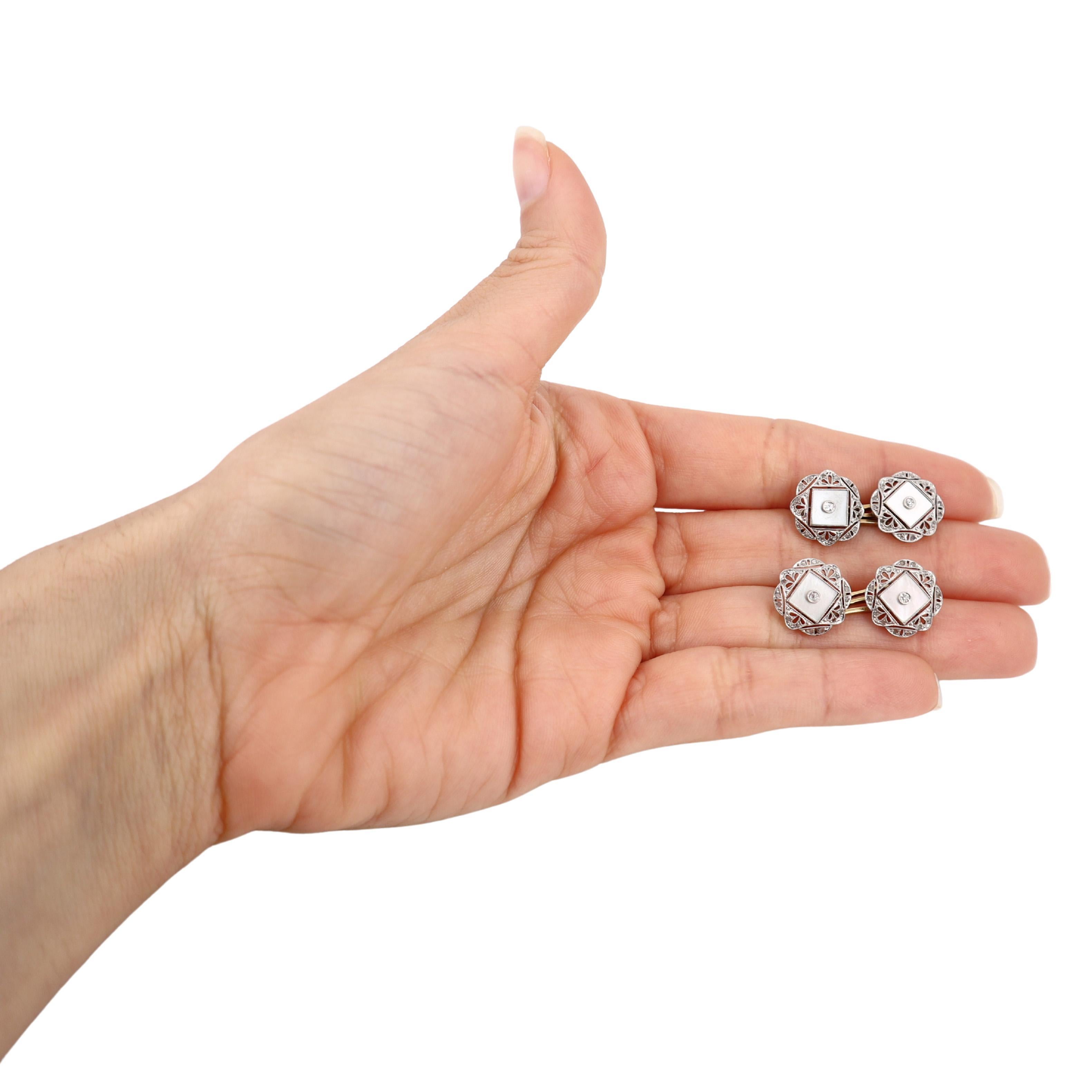 These exquisite Art Deco filigree double cufflinks, dating back to the circa 1920s, are a stunning blend of 18kt yellow gold and platinum accents. The intricate filigree design showcases the craftsmanship of the era, making these cufflinks a true