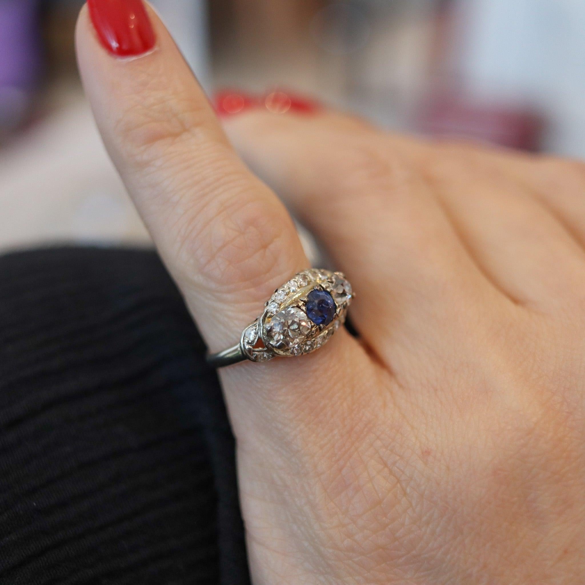 An American art deco ring with diamonds and a sapphire.

This beautiful antique band ring, was created in America during the Art- deco period, back in the late 1920. The ring is entirely crafted in solid white gold of 18 karats with polished finish