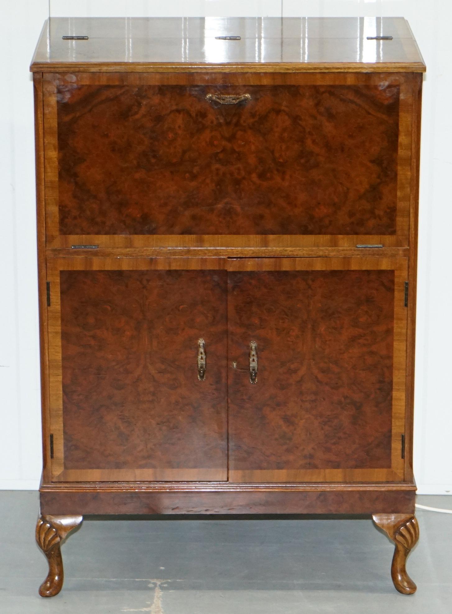 We are delighted to offer for sale this stunning original 1920s Art Deco burr walnut drinks cabinet

A very good looking well made and decorative piece of functional furniture, the burr walnut veneer is book cut and looks sublime from every angle,