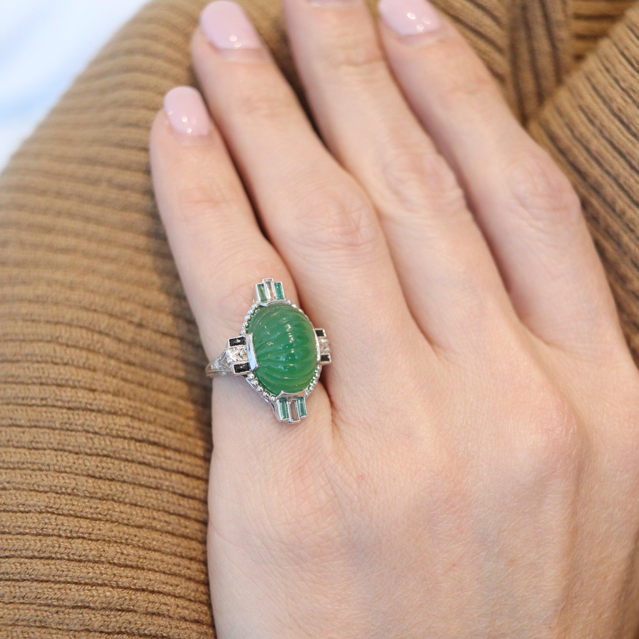 An art deco cocktail ring with chrysoprase.

This is a colorful cocktail ring created in America during the Art Deco period, back in the 1920-1925. The ring has been carefully crafted with skyscraper geometric patterns in solid white gold of 18