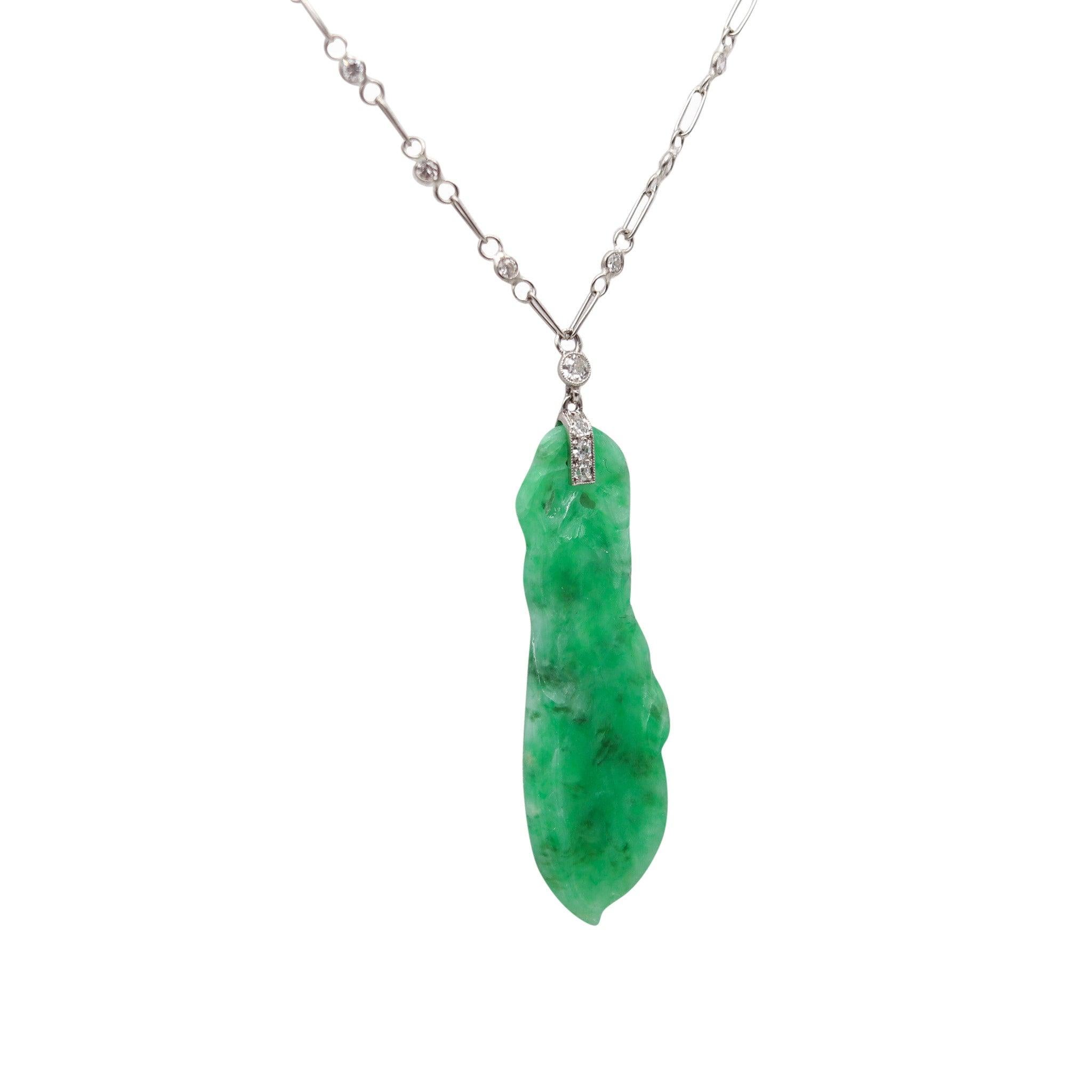 An art-deco jadeite pendant necklace with diamonds.

This is a beautiful pendant necklace created in Europe with orientalism motifs during the art-deco period, back in the 1920. The chain necklace was carefully crafted with geometric links in solid