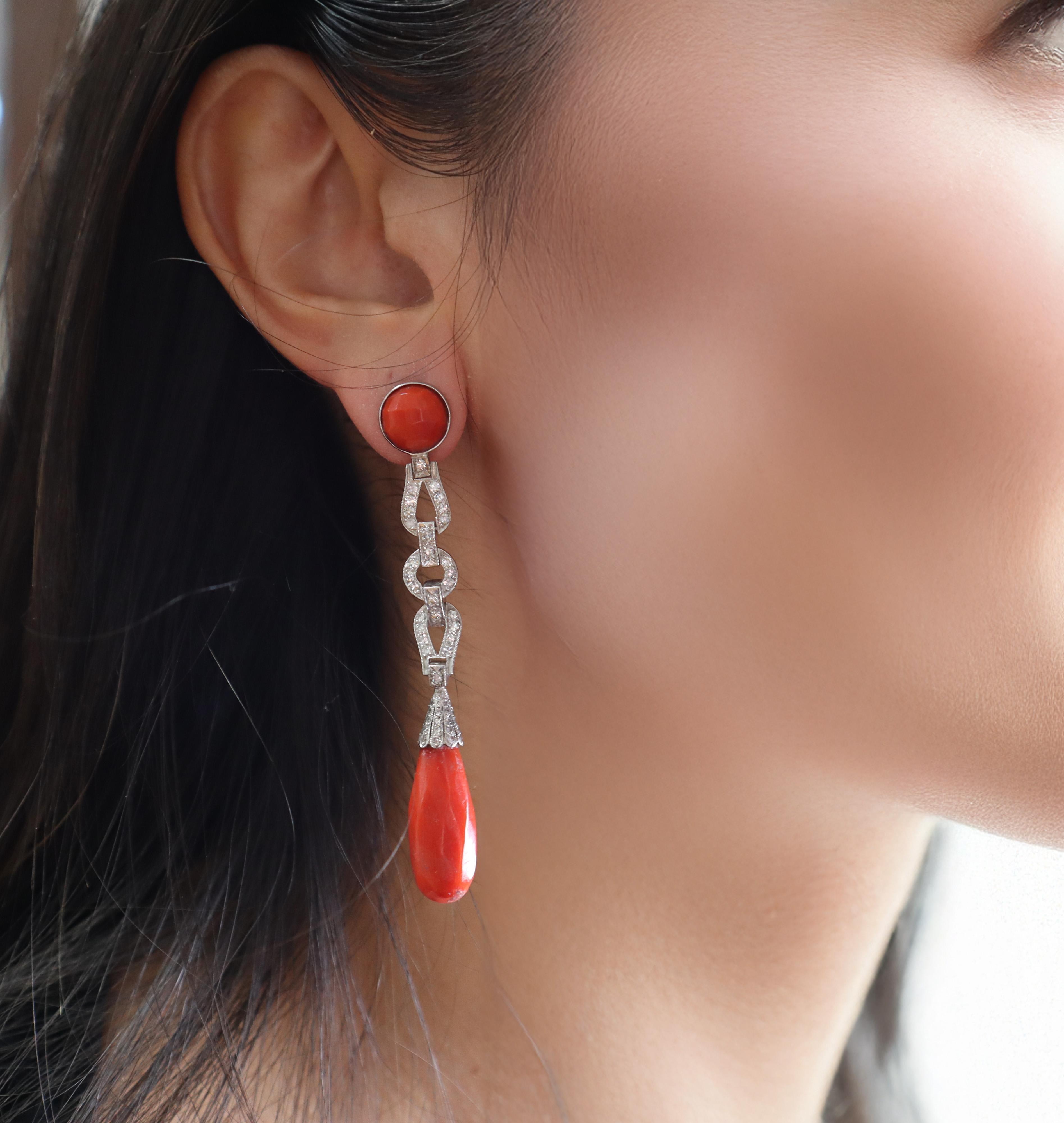 Discover a pair of hanging earrings crafted in platinum, featuring secure 14k yellow gold backs and posts. These elegant earrings are accented with stunning single cut diamonds, totaling approximately 0.90 carats, adding a brilliant sparkle to any
