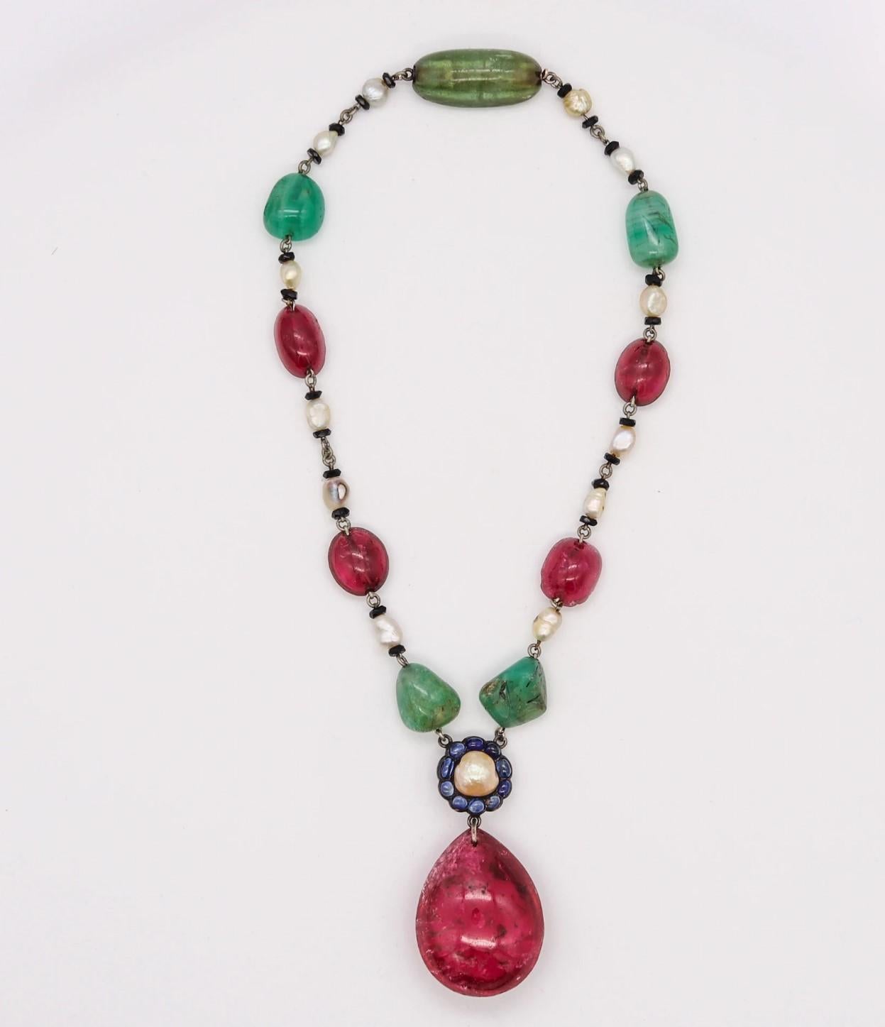 Art Deco Mughal style jeweled necklace.

Beautiful and colorful piece, most probably created in England during the Art Deco period, back in the 1920. This very unusual and striking necklace was assembled in the Mughal Tutti Frutti style with silver