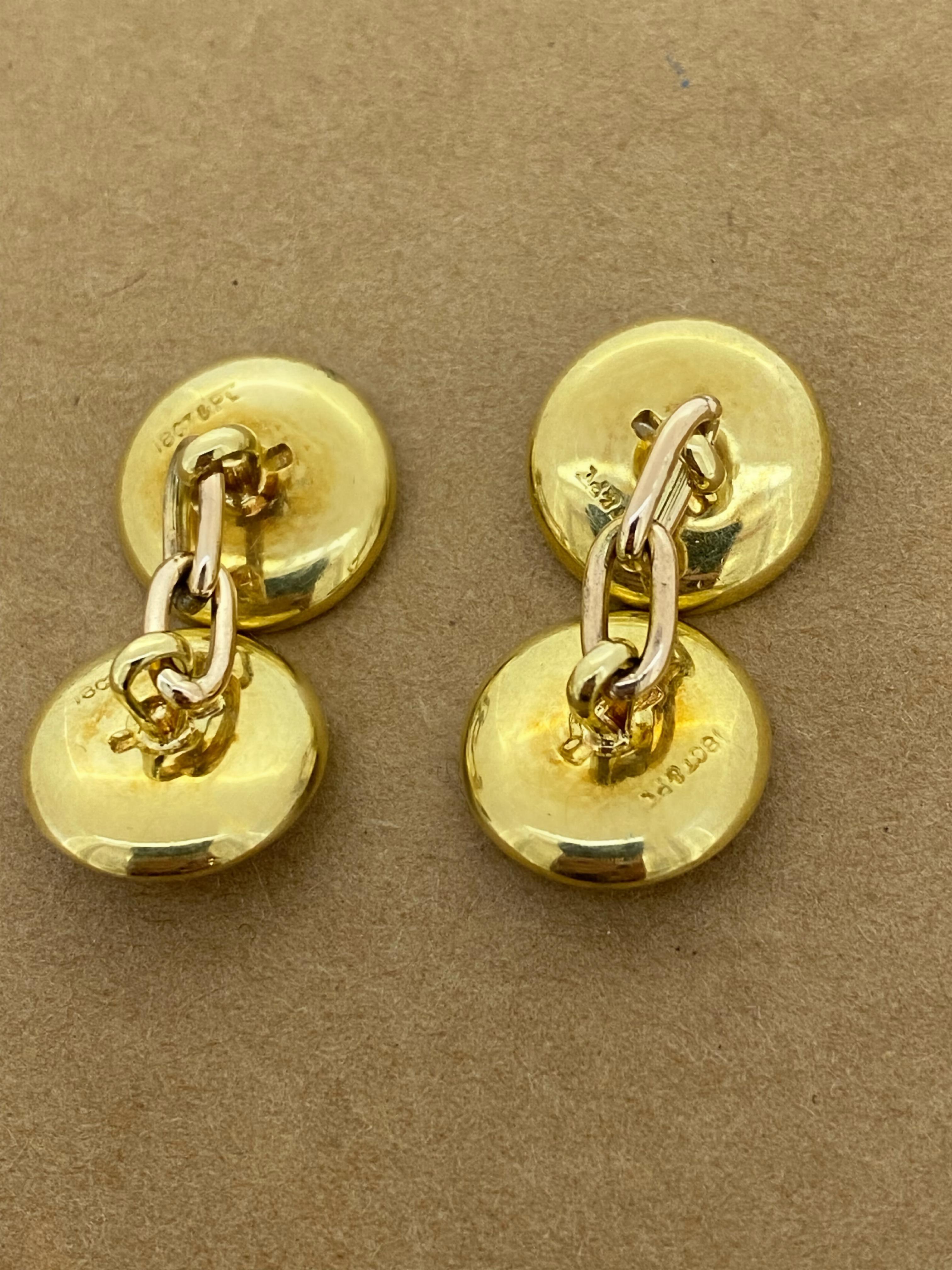 Designed as chain link cufflinks,

featuring 2 Disks 
set in platinum 
this piece is antique, 
dating back to Art-Deco era 
 
Finely crafted in 18K Yellow Gold & 
Platinum 
 
Elongated oval links secure these cufflinks on the cuff.
~~~

Total item's