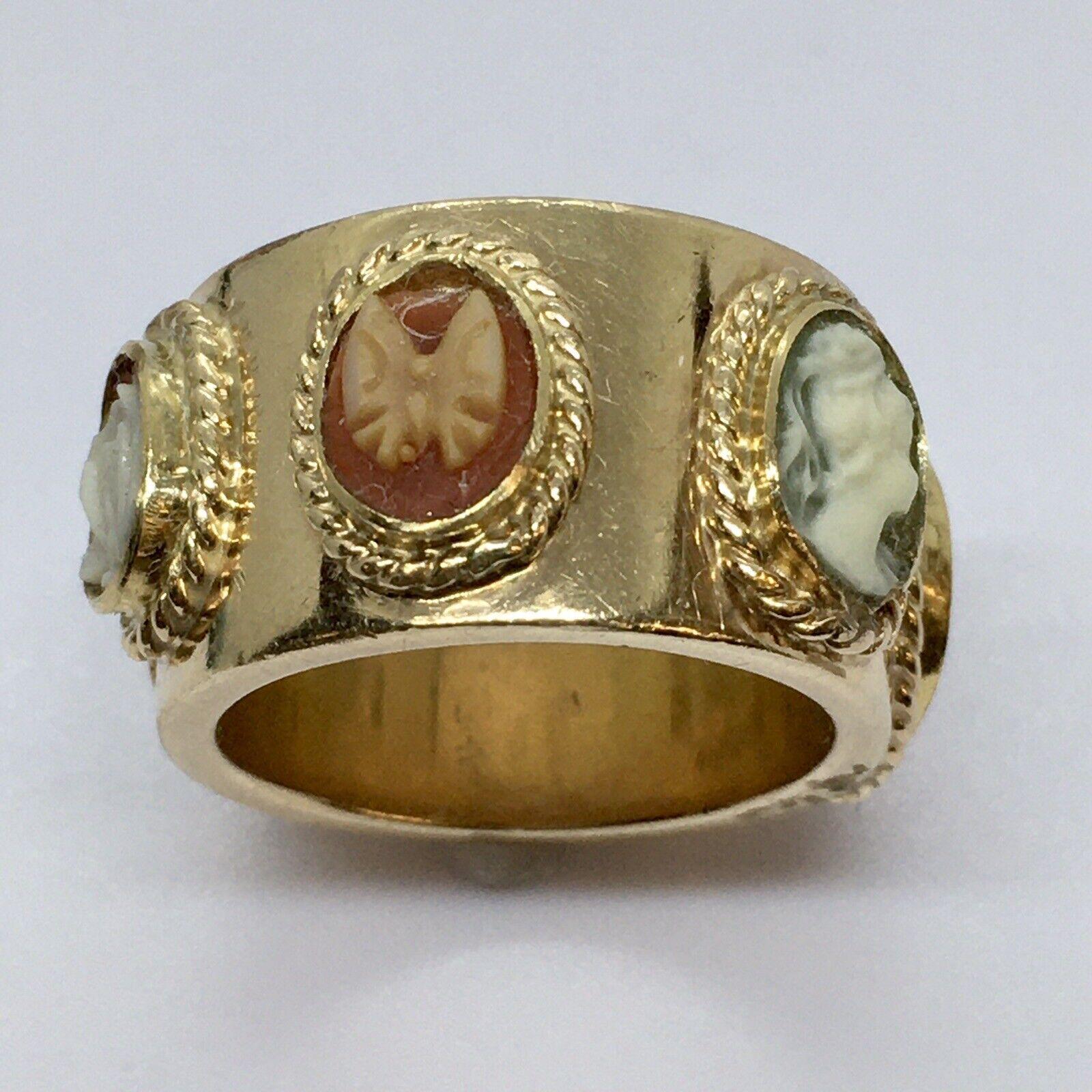 Art Deco 1920s Cameo Band Handmade Hallmarked 14K Gold


Hallmark , Marked 14K, acid tested
Size 6.5
12 mm wide, 2 mm thick band
6 cameos, no damage
Weighting 19.7 gram

Authentic and Original American antique in excellent condition considering the