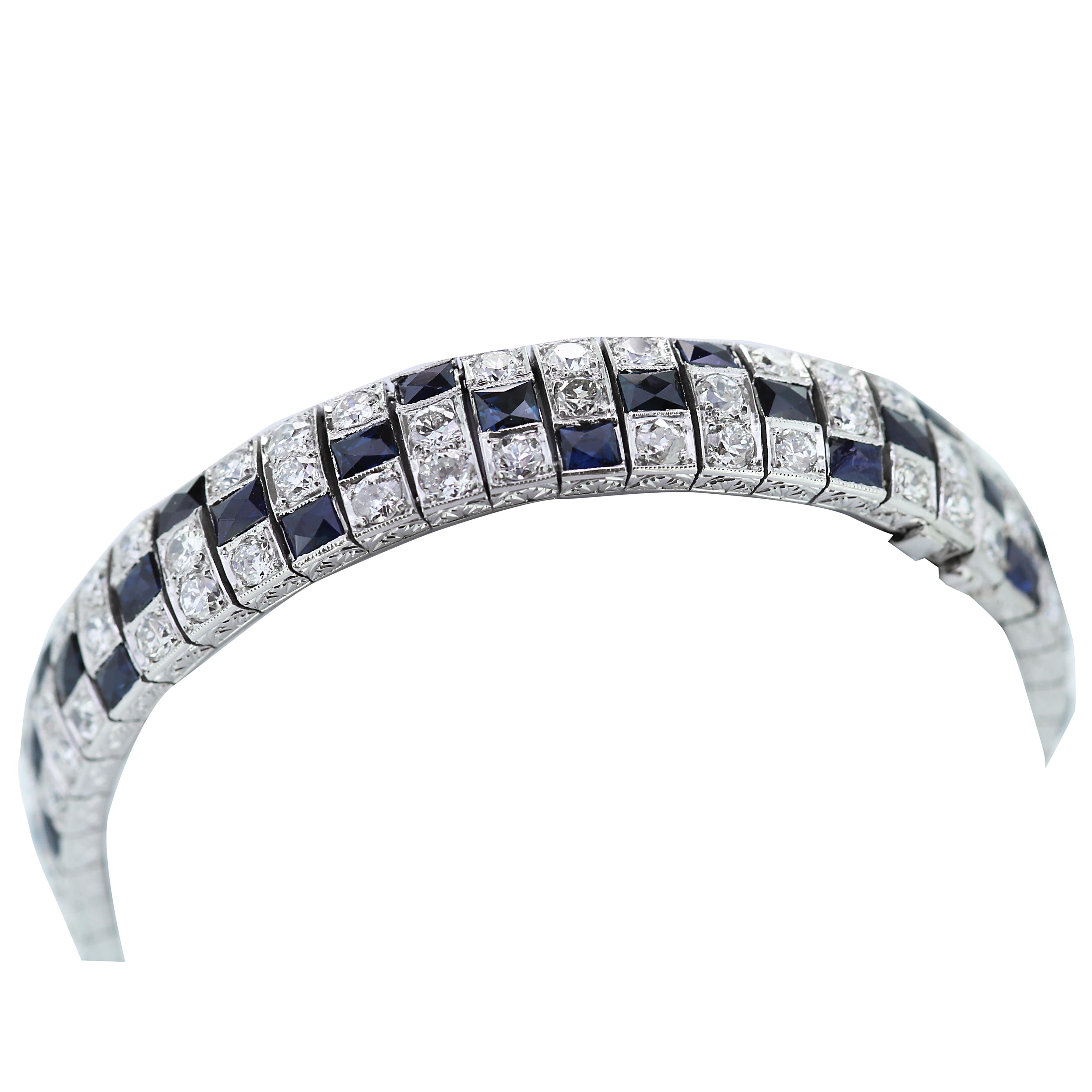 Bright and brilliant 3 rows blue sapphire and diamond bracelet with hidden clasp and beautifully engraved details on the side in platinum.
48 rectangular cut sapphires approximate total weight 8.0 ct
96 Old brilliant cut diamonds approximate total