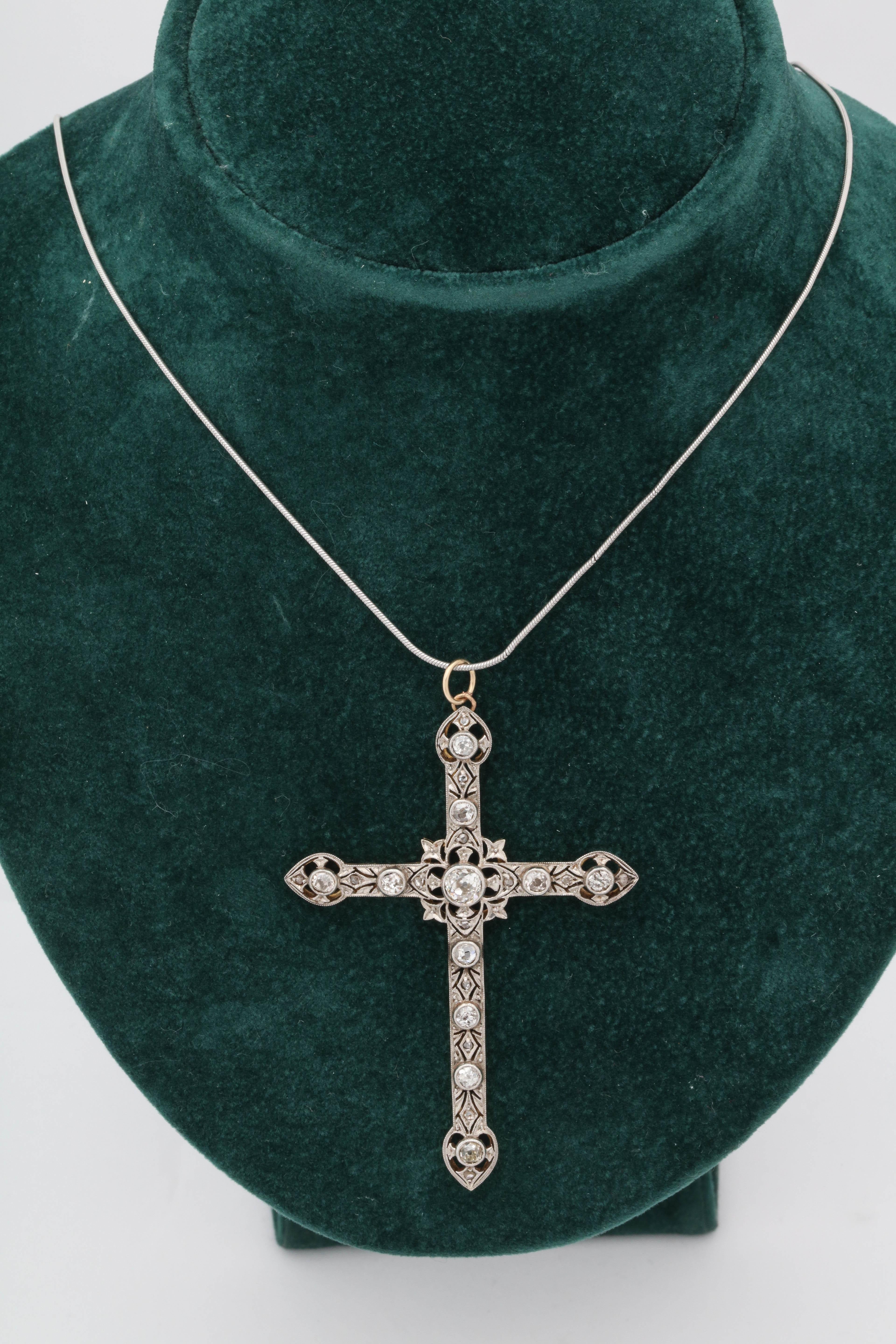 One Ladies Cross Pendant Handmade In Platinum And Diamonds And 18kt Gold Back With 18kt Gold Bail. Approximate Diamond Weight 1.75 Carats , Center Stone Weight Approximately .50 Old Mine Cut Diamond. Circa 1920's Made In The United States Of