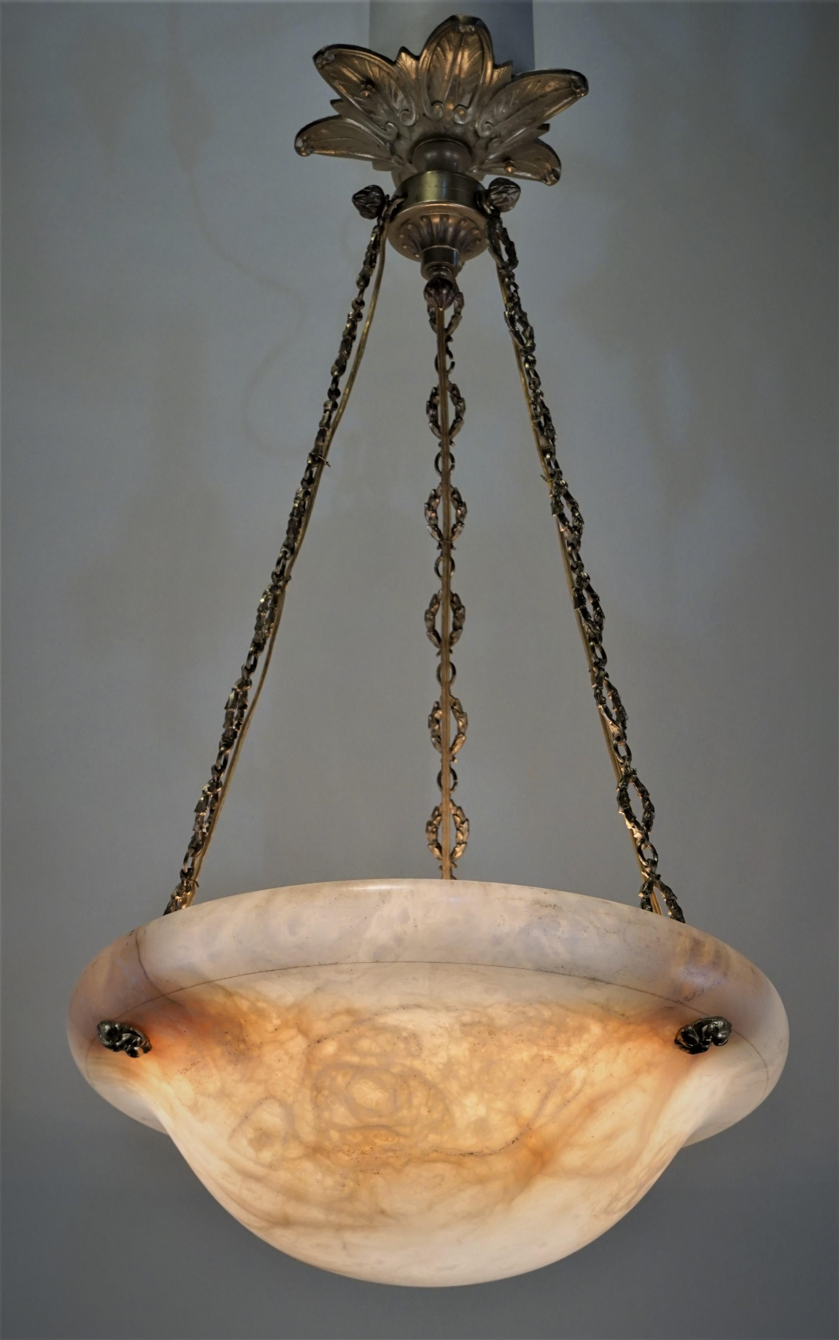 A simple but elegant soft beautiful color alabaster chandelier with total of 6 lights and fantastic bronze chain and canopy.