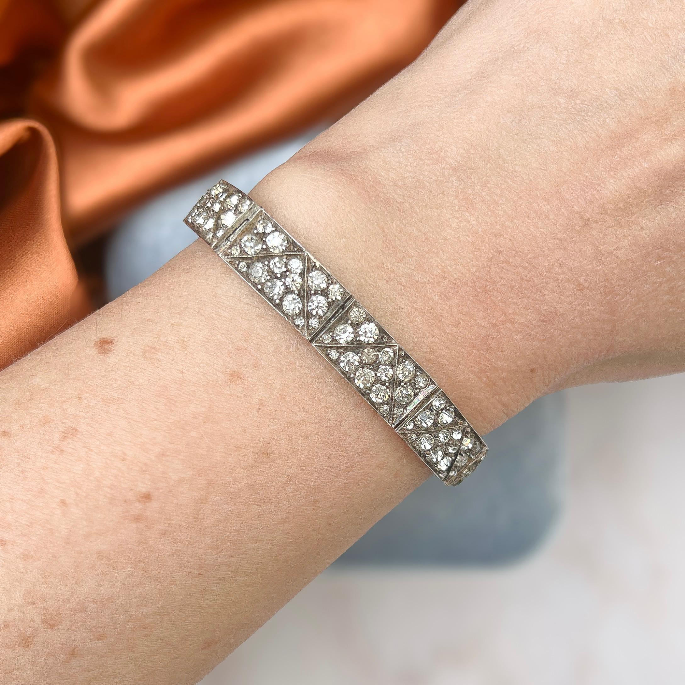 This stylish bracelet evokes the Art Deco era and was made in Germany.  

Condition Report:
Excellent

The Details...
This bracelet is made from silver - it is marked '935', which is commonly associated with silver made in Germany. It is set with