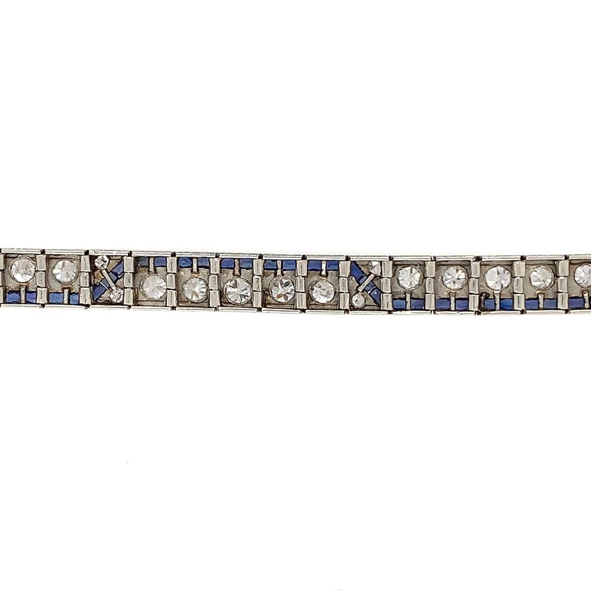 Metal: Platinum
Condition: Excellent
Year Of Manufacture: Circa 1920s
Length: 6.45 inches
Gemstone: Diamond, Synthetic Sapphire
Old European Cut Diamond Weight: 4.5 CT
Color: G-H
Clarity: Vs1-VS2
Total Item Weight:  23 g

SKU#B-01818