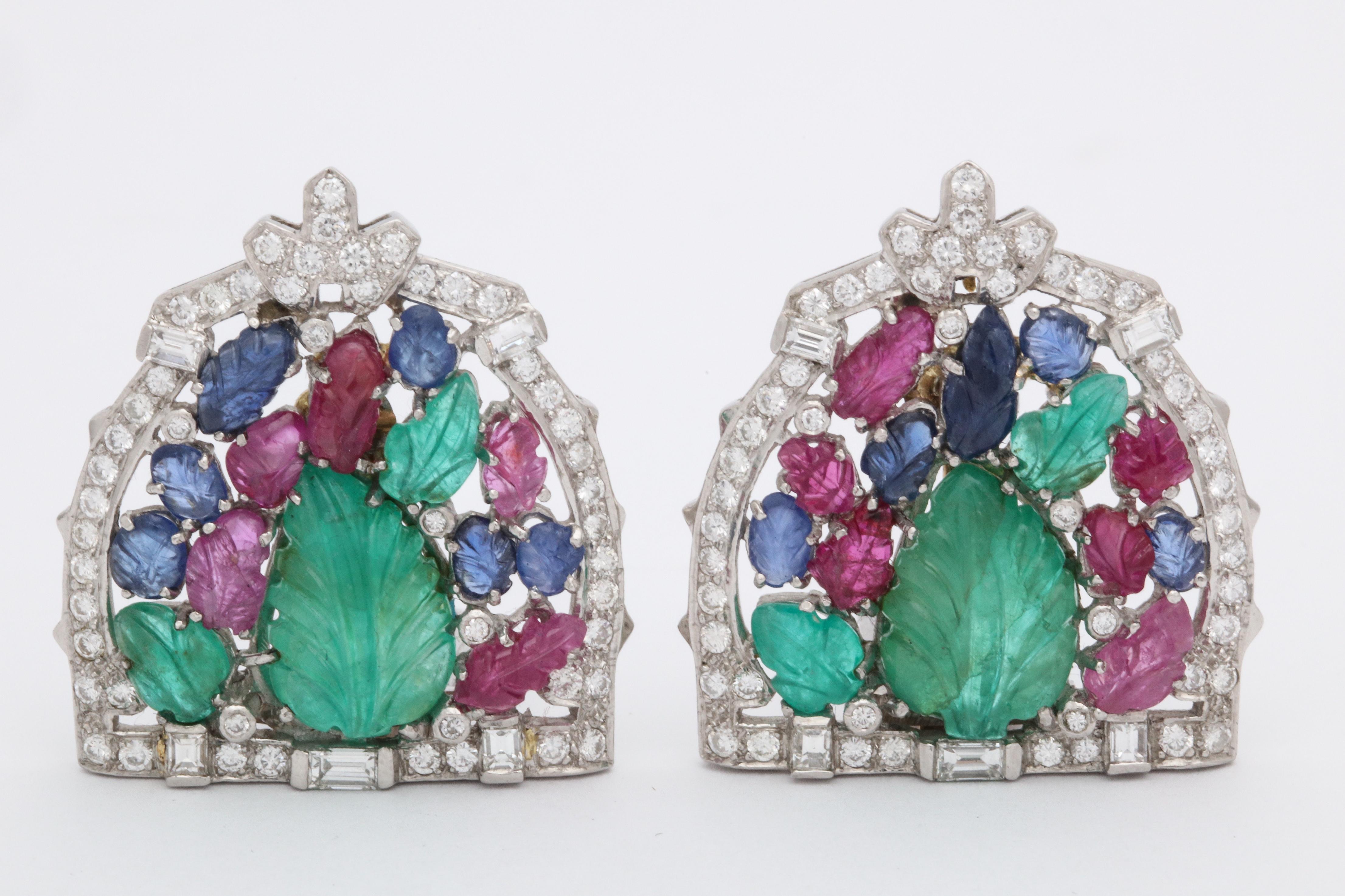 One Pair Of Ladies Platinum With Gold And Platinum Retractable Posts Earclips Embellished With Multicolored Carved Emeralds,Rubies And Sapphires. Earclips Further Embellished With Numerous Antique Cut Diamonds Weighing Approximately [2.5] Cts.