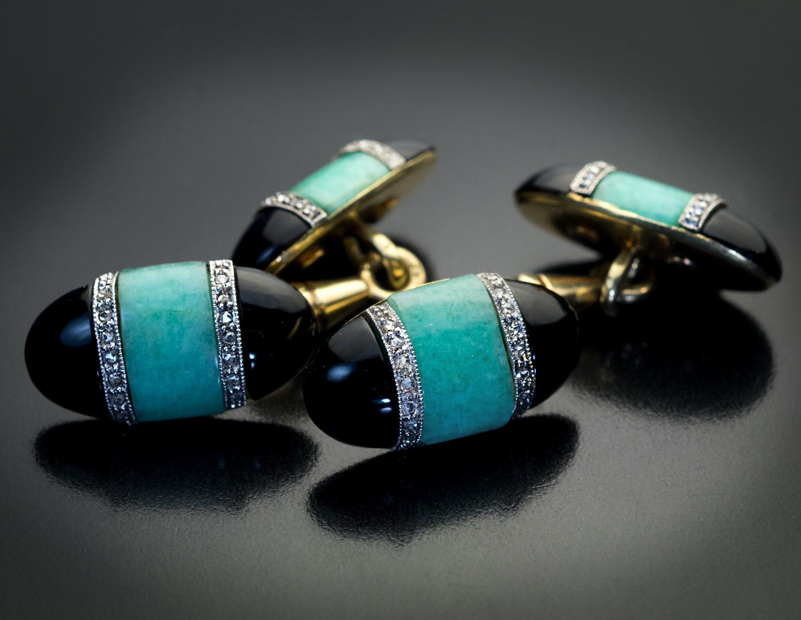 Circa 1925

Art Deco era double sided 14K gold cufflinks are centered with carved bluish-green amazonite panels flanked by half-moon black onyx panels and accented by rows of tiny old rose cut diamonds set in platinum.

The cufflinks are marked with