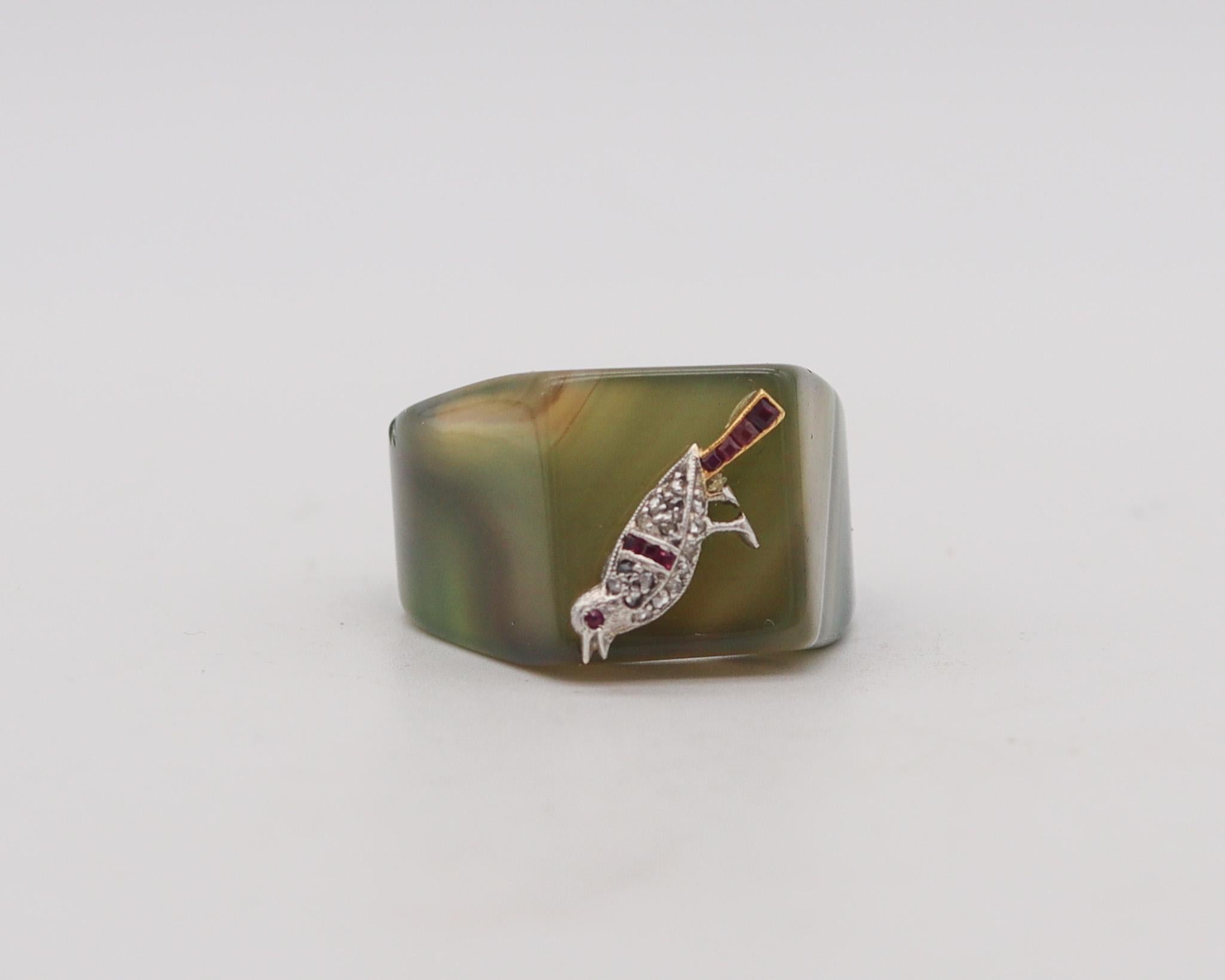 An art deco carved agate ring with a stylized pigeon.

Very handsome and unusual cocktail ring, created during the art deco period, back in the 1925. This ring is made up from a carved single piece of greenish agate and a pigeon crafted in solid
