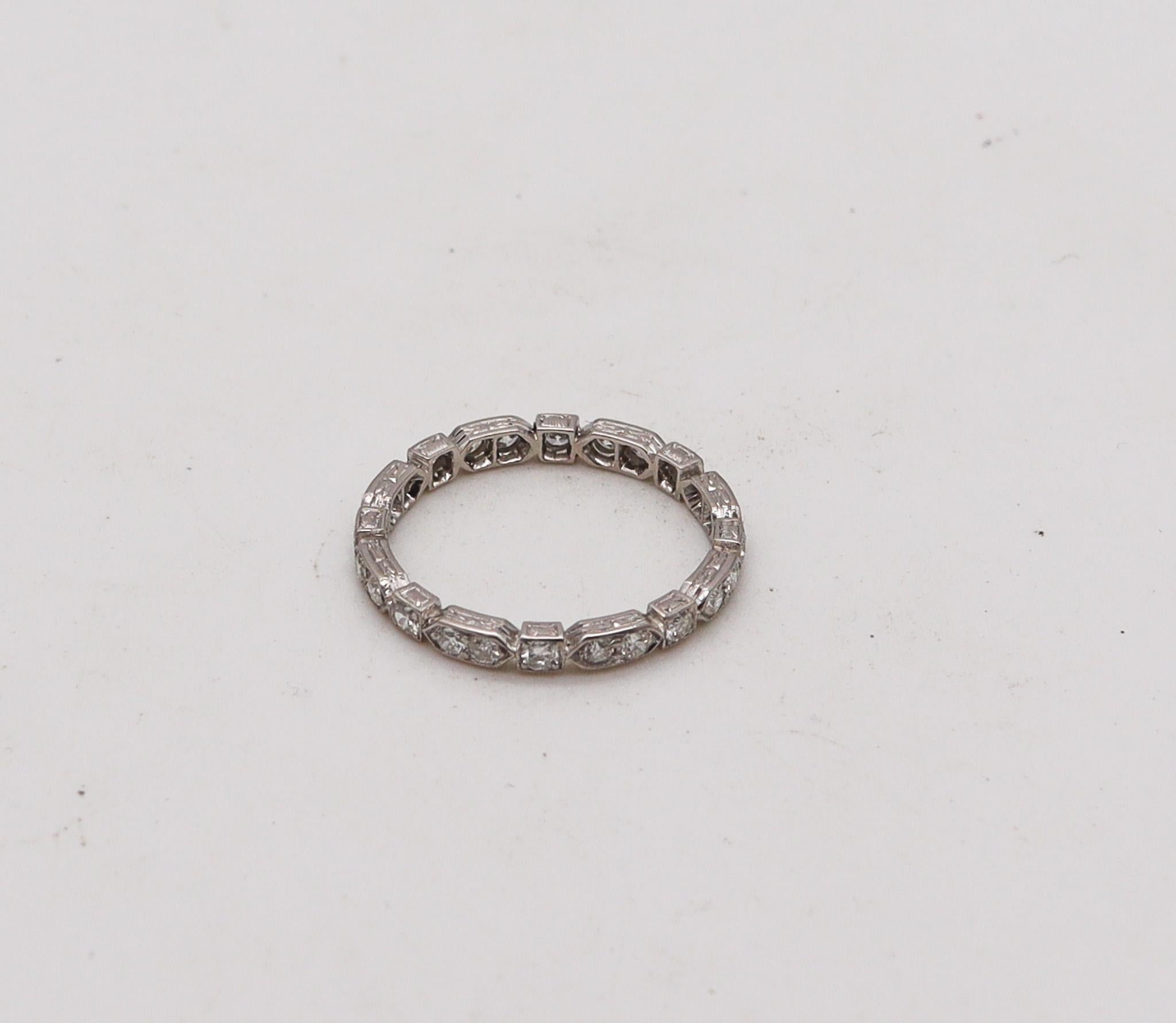 Eternity ring band with diamonds.

Gorgeous and very unusual eternity band ring, created in America during the Art Deco period, back in the 1925. It was crafted in solid .900/.999 platinum with high polished finish and embellished with a great