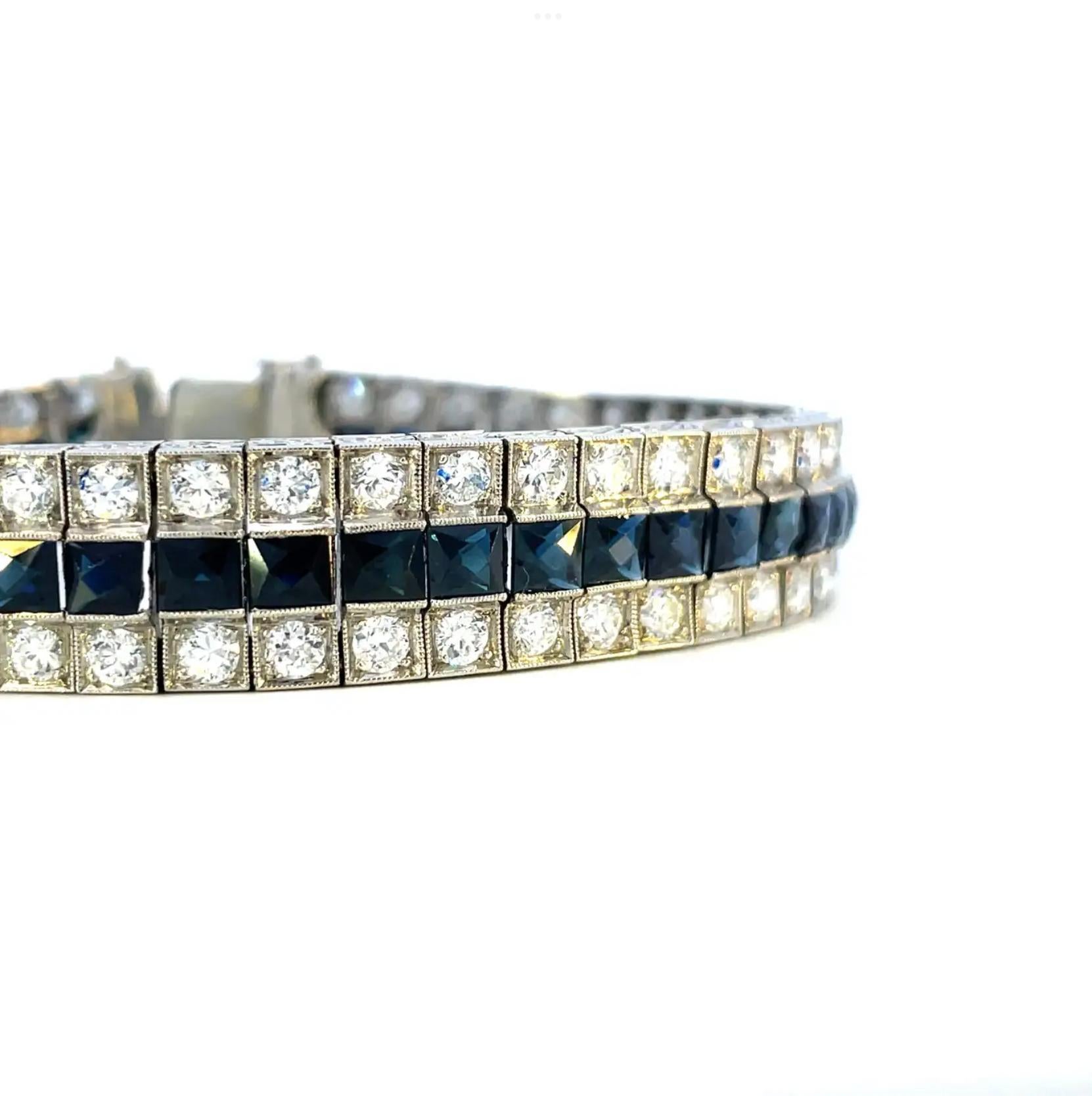 This 1925 Art Deco platinum 3 row diamond bracelet with blue French cut sapphires is a true heirloom from the glitz and glamour of the Roaring Twenties. This stunning bracelet is marked by opulence and elegance; 7.5