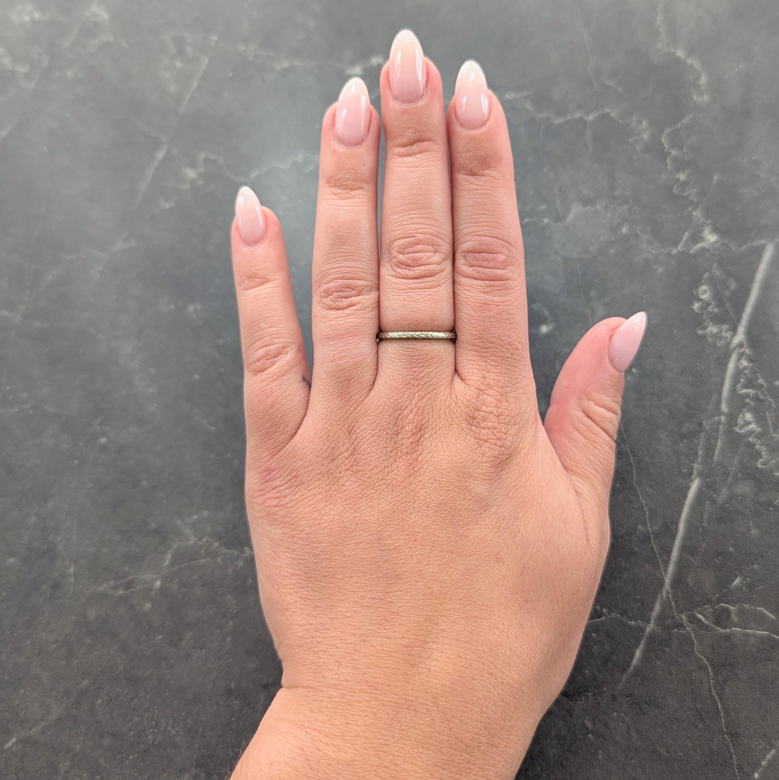 Featuring an engraved wheat motif fully around
With a matching enraged profile
Stamped for 18 karat gold
Inscribed 'M.B.N. to K.N.D. Dec.31-22'
Circa: 1929; via dated inscription
Ring size: 7 1/4 and sizable
Measures north to south 2.0 mm and sits