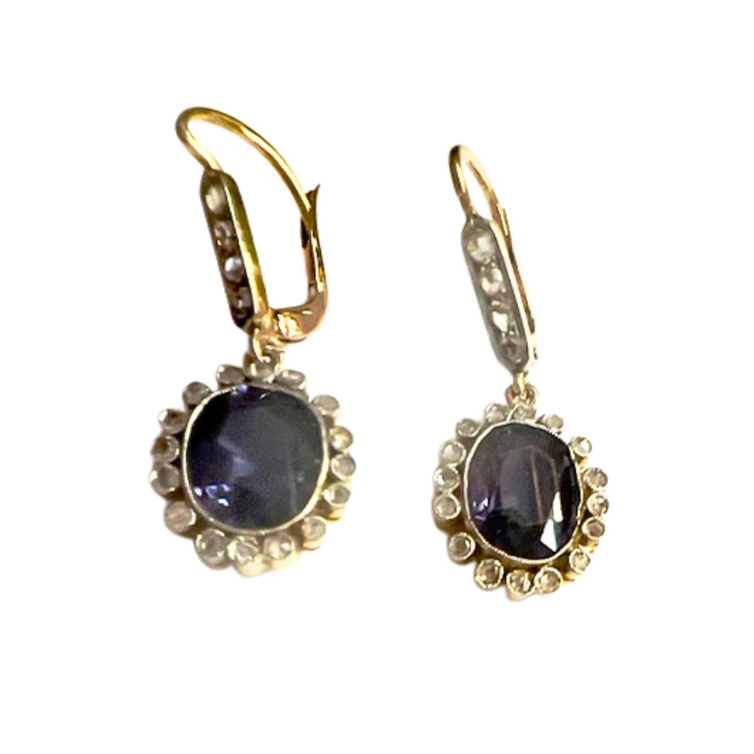These Art Deco-style earrings from the 1930-35 period are crafted in 18K gold with platinum and feature Amethyst and Diamonds. 
They have a weight of 5.03 grams and measure 3 cm in length. 
The Diamonds are rose-cut, totaling 0.5 carats, and are of