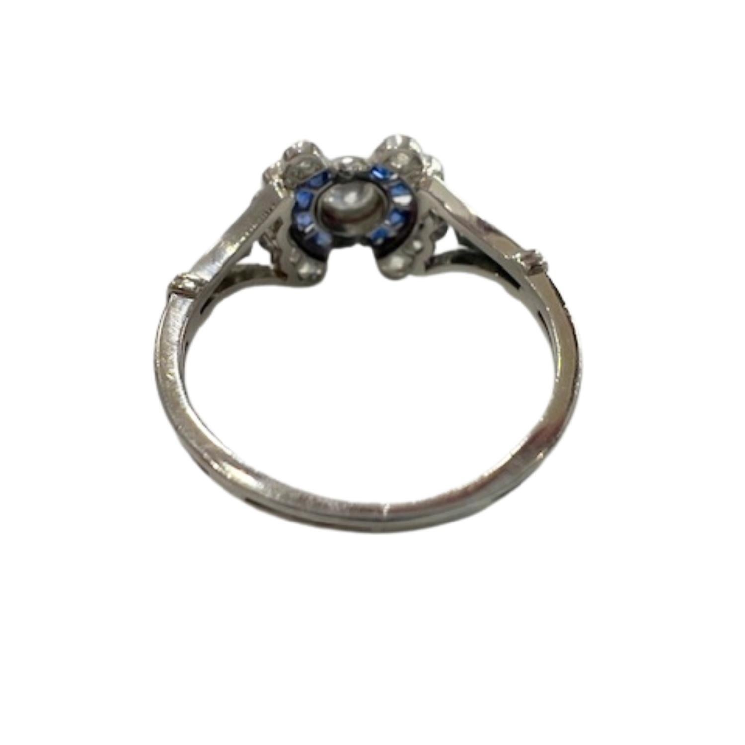A vintage Art Deco ring from the 1930s, crafted in platinum with antique diamonds and custom-cut sapphires. A timeless piece with classic elegance.

**IN STOCK** 

Key Features:

Metal: Platinum 950
Main Stones: Antique Cut Diamonds (0.40 ct