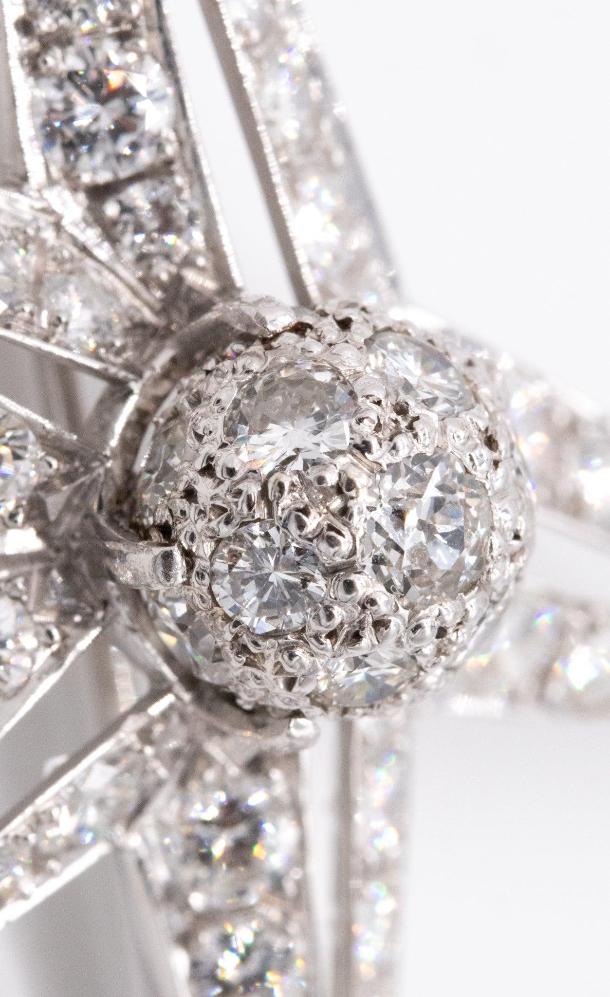 Sparkling celestial disco ball convertible pendant brooch. 

This is a beautiful convertible pendant-brooch, created in America during the art-deco period, back in the 1930. The stunning piece has been crated in the shape of an asymmetric celestial