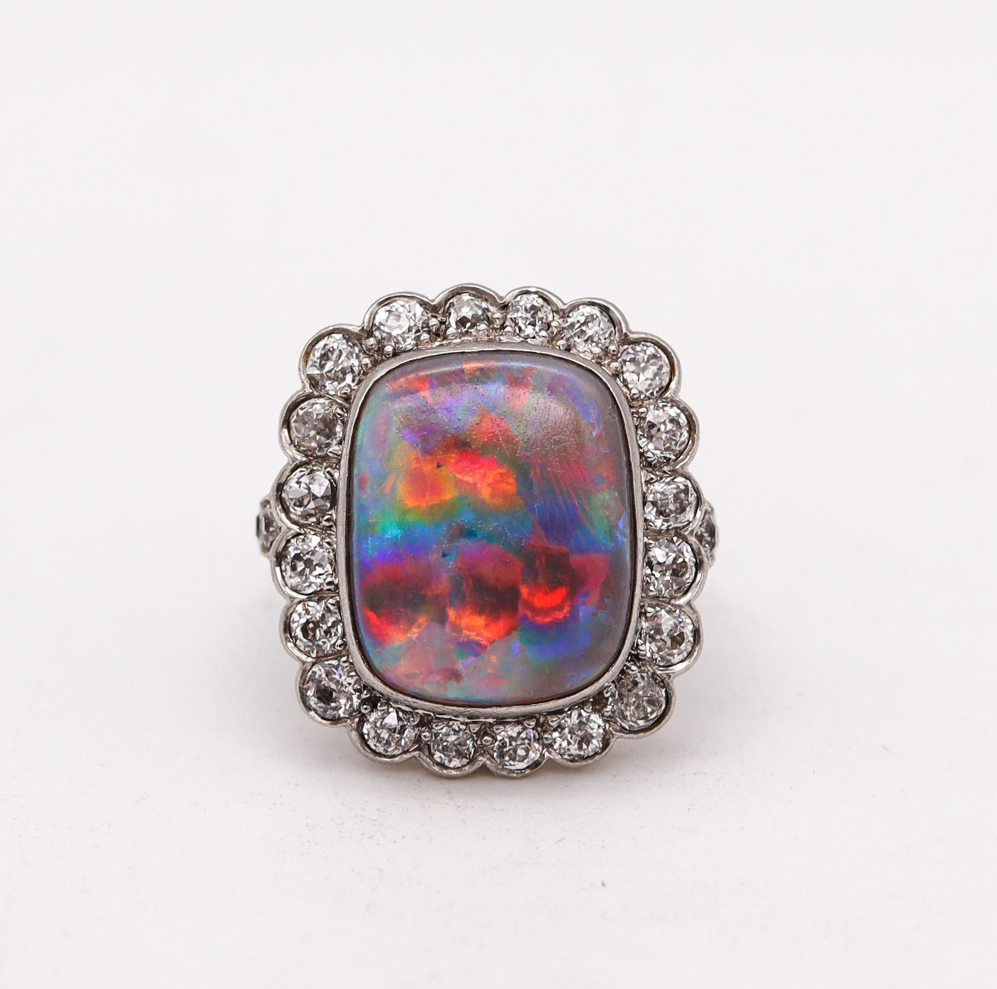 An art deco ring with Australian opal.

Exceptionally beautiful ring, created during the iconic period of the art deco, back in the 1930. This colorful ring personify the deco period and has been crafted in a cushion shape in solid platinum with