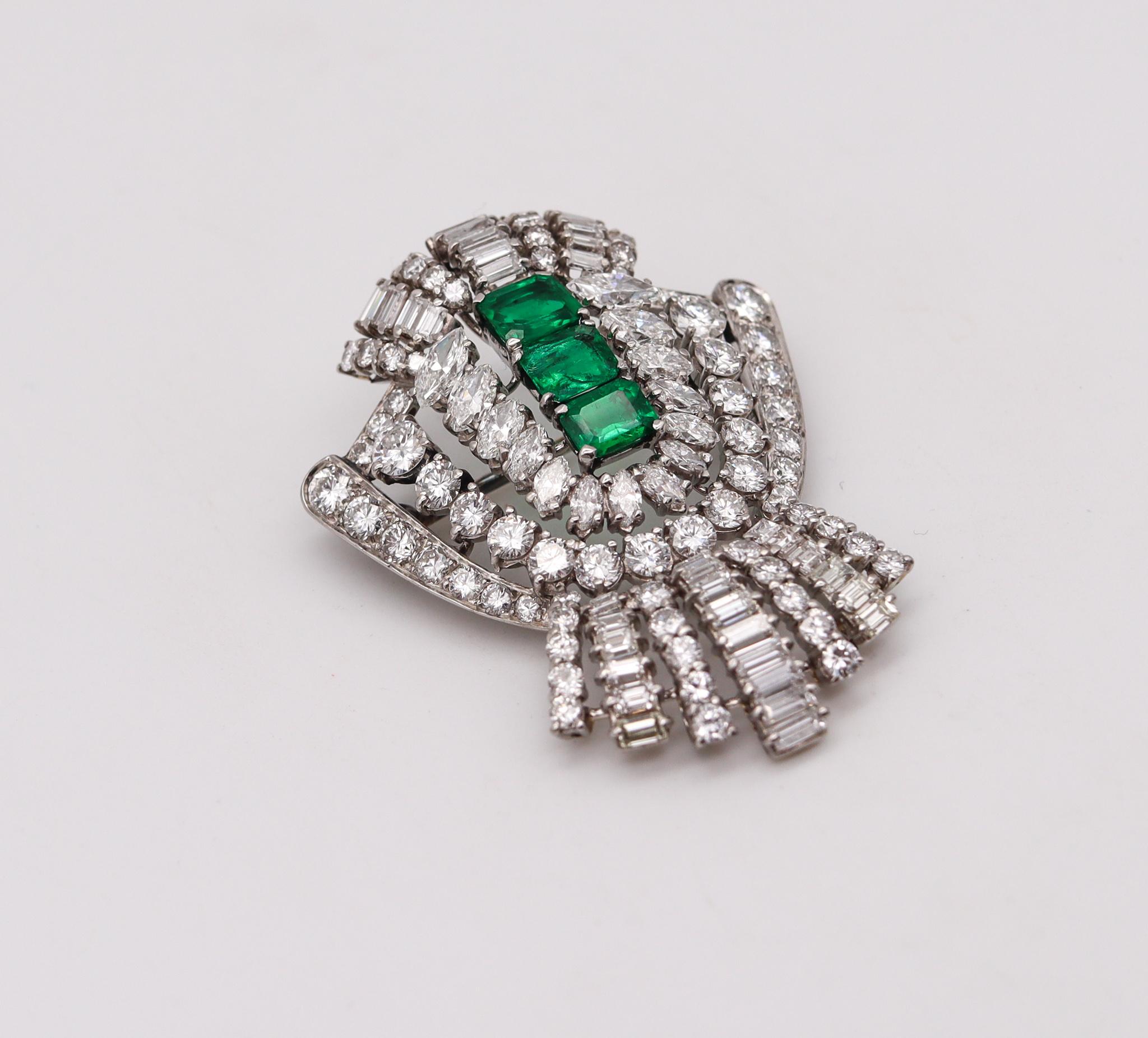 An art deco gem set brooch with emeralds.

Magnificent piece of jewelry, created during the art deco period, back in the 1930. This convertible pendant and brooch has been crafted in solid platinum .900/.999 and fitted at the reverse with a hinged
