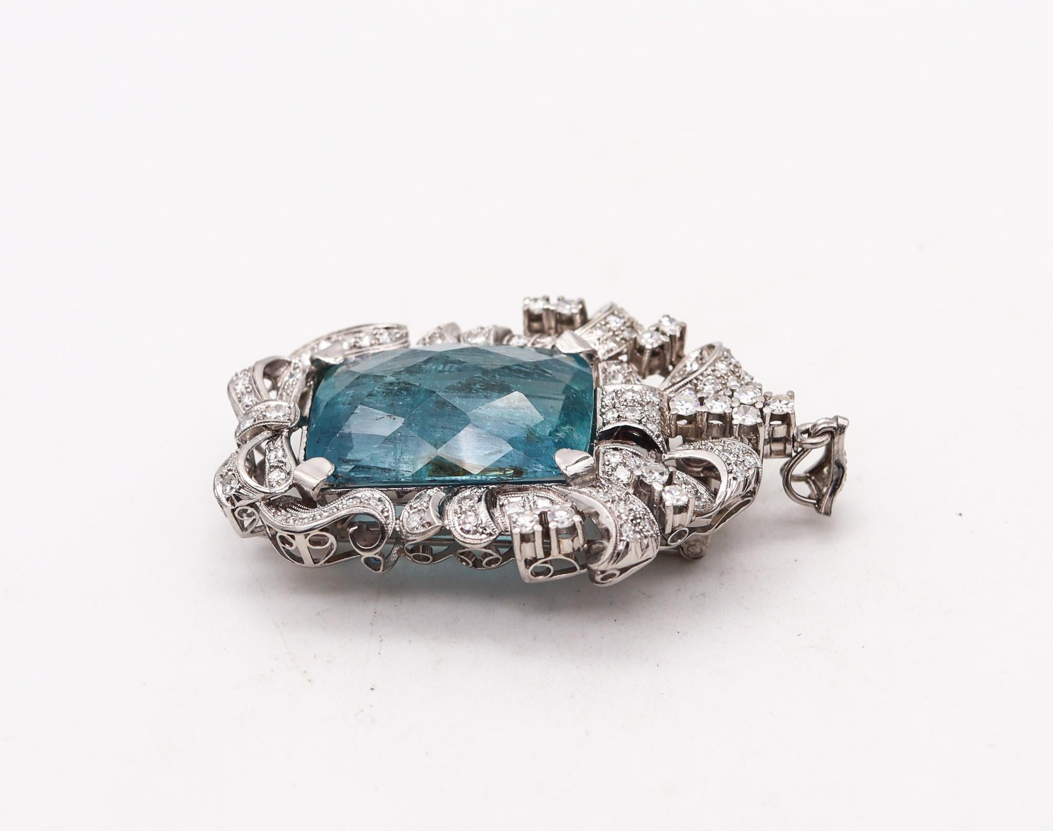 Art deco convertible pendant brooch with aquamarine.

This is an extraordinary piece of jewelry, created during the art deco period, back in the 1930. This beautiful and versatile piece can be converted into a pendant or a brooch and wear in