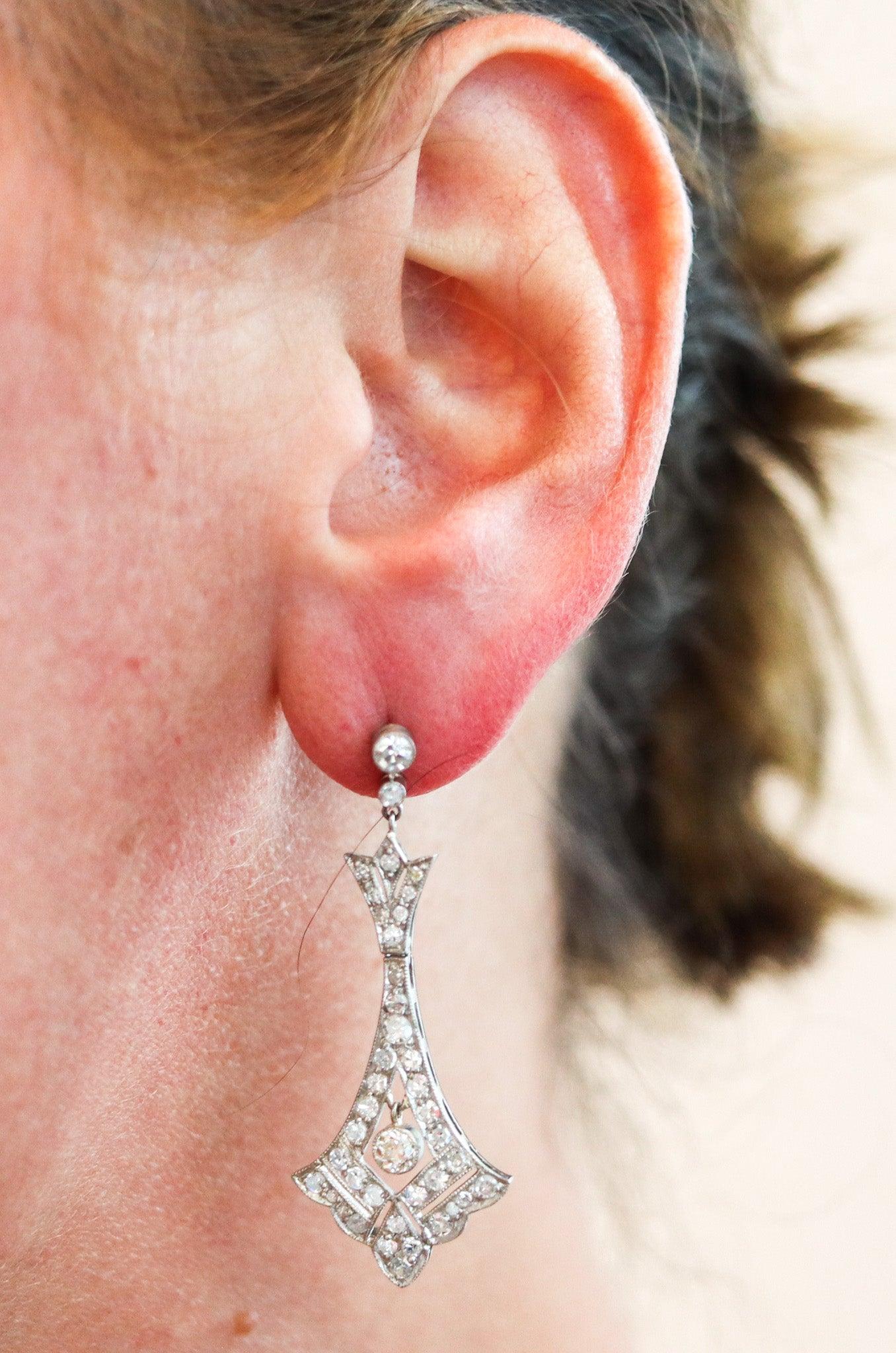 Pair of art deco platinum dangle earrings

This is a beautiful antique pair of dangle drops earrings, created during the art deco period, back in the 1930. This pair of earrings was most probably crafted in Europe, in solid platinum and are mounted