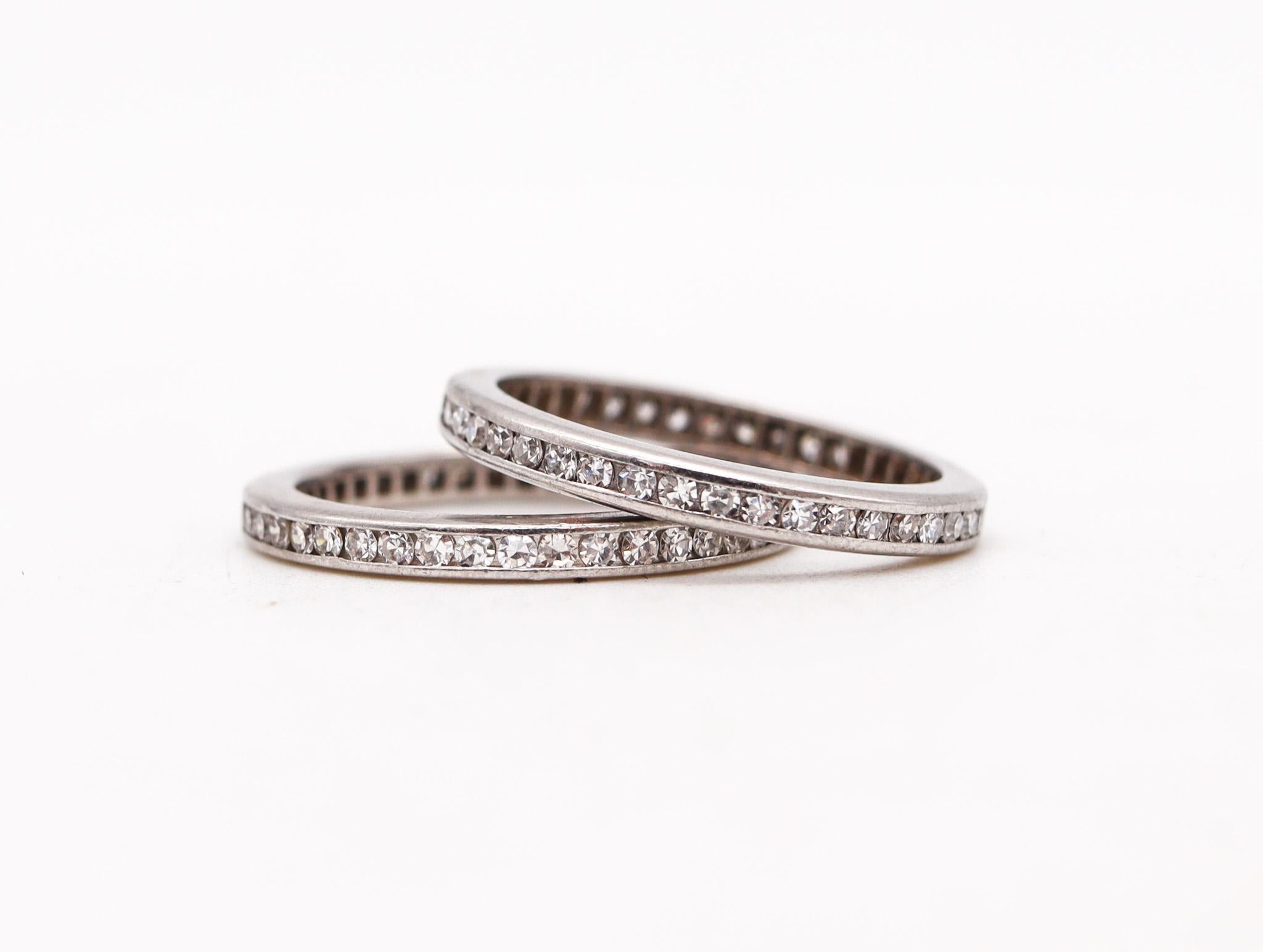 Duo of eternity rings with diamonds.

Very nice original pair of eternity band rings, created in America during the Art Deco period, back in the 1930. They was crafted in solid .900/.999 platinum with high polished finish and embellished with