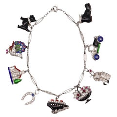 Art Deco 1930 Eight Charms Bracelet in Platinum Enamel with Diamonds and Gems