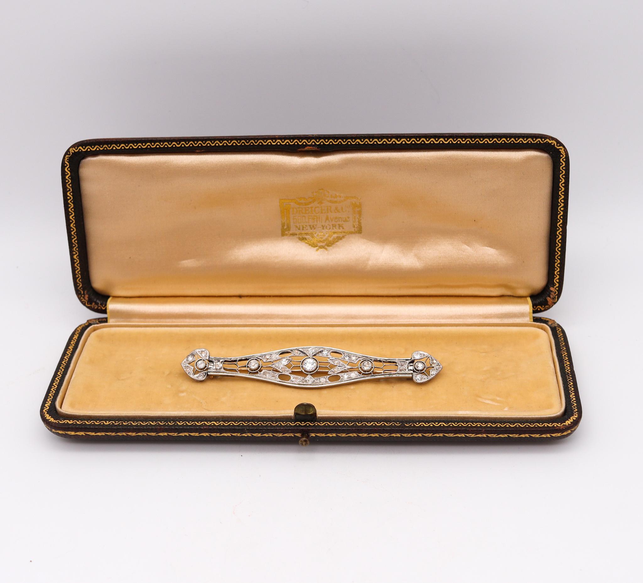 An art deco brooch with diamonds.

Beautiful classic brooch, created during the American art deco period, back in the 1920 and 1930. This elongated geometric brooch has been crafted in .900/.999 platinum with 18 karats yellow gold accents in the