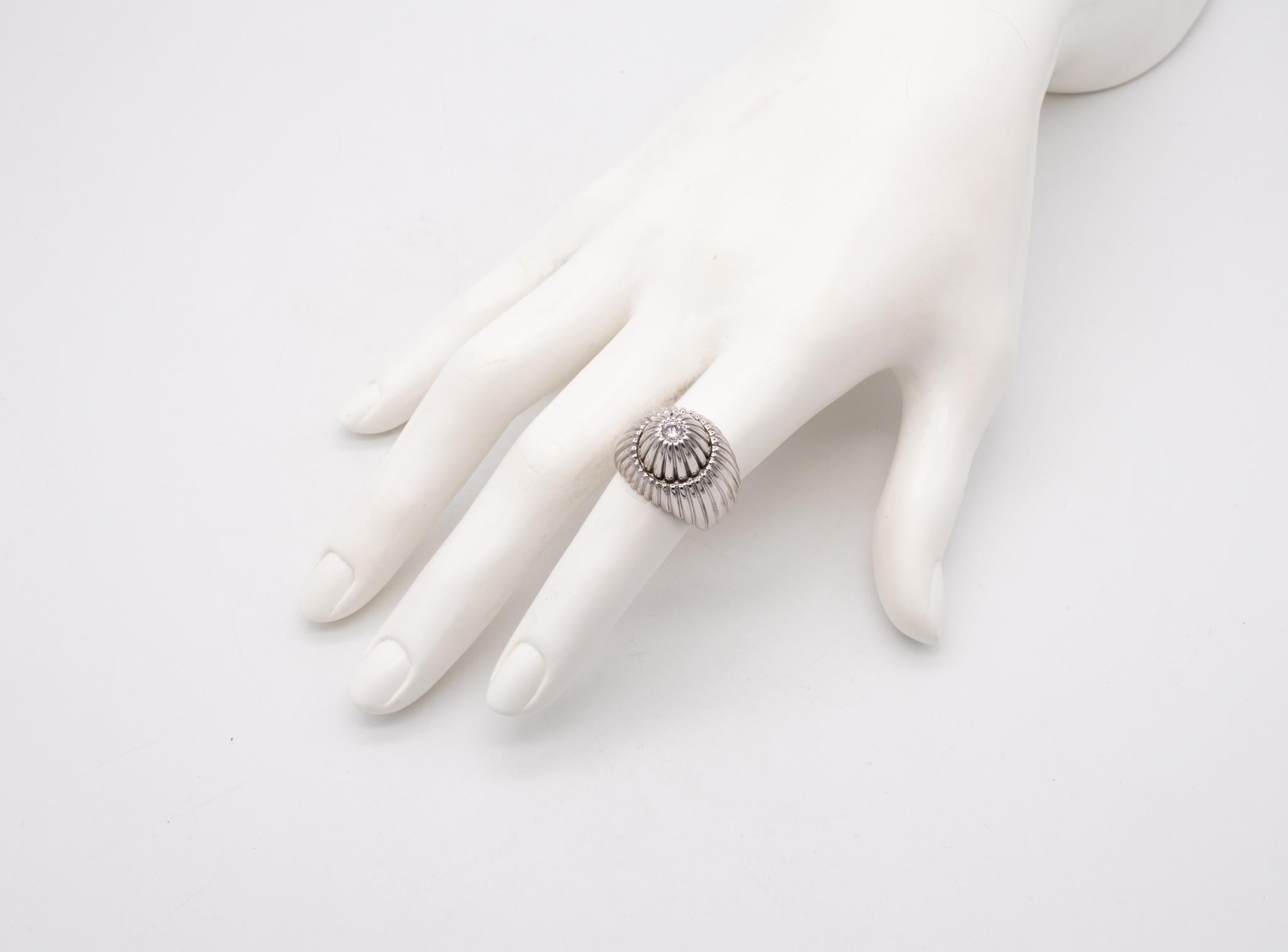 European Art Deco cocktail ring.

Very interesting vintage piece, created in Europe during the Art Deco period, circa late 1930's. This bombe cocktail ring has been crafted in solid white gold of 18 karats, with high polished finish. The design is