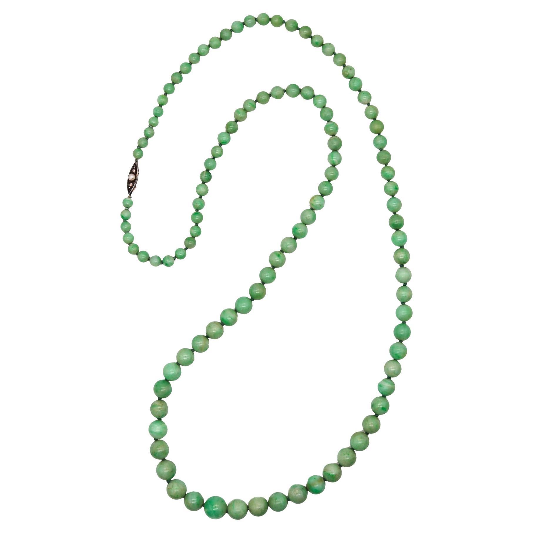 An art deco graduated jadeite beads necklace.

Beautiful long necklace, created during the art deco period, back in the 1930. It is composed by multiples graduated spheres of mottled jadeite jade with the original security boxed lock.

Jadeite Jade: