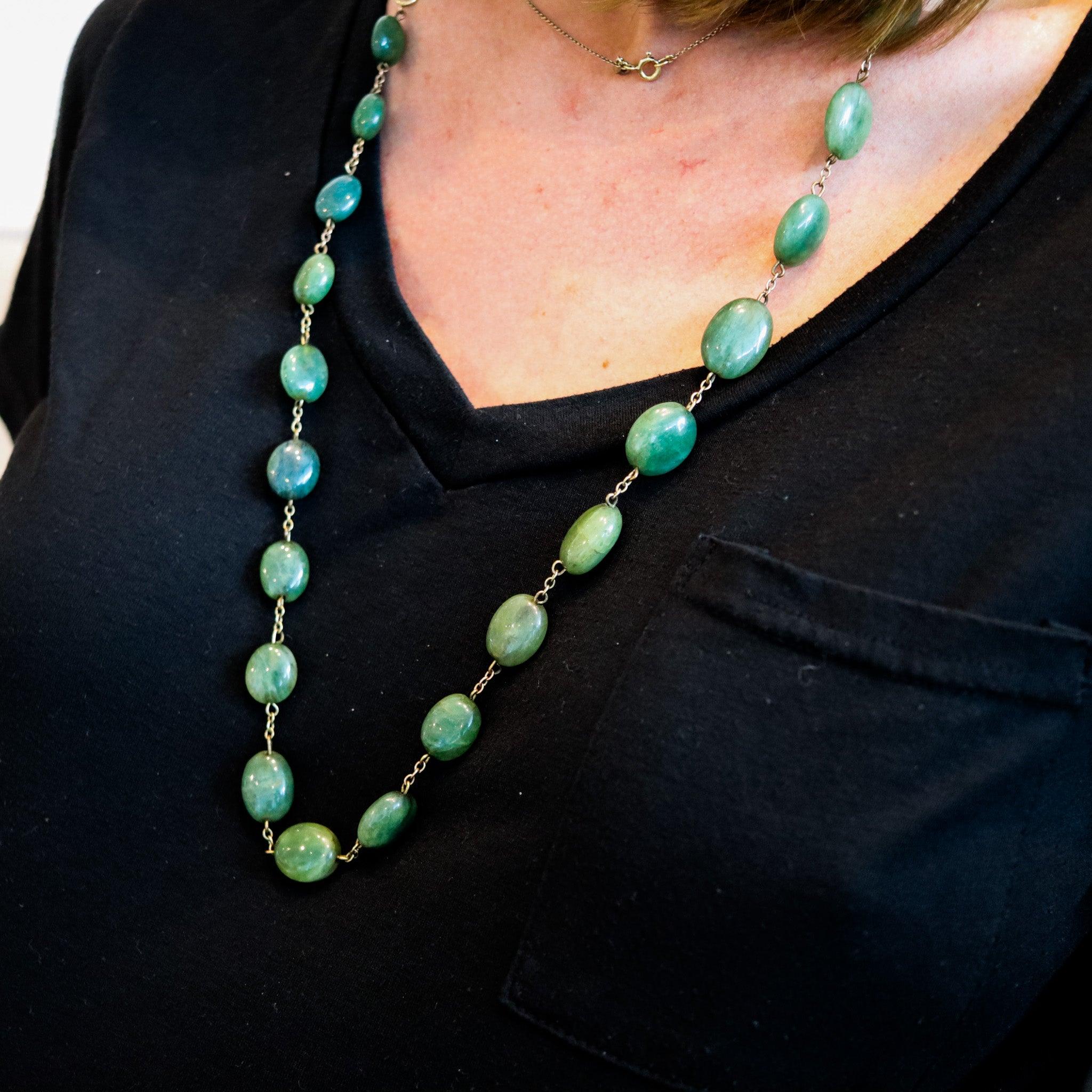 An art deco necklace with graduated green jades.

This is a very interesting casual long necklace with beads, created in Europe during the art deco period, back in the 1930s. This necklace was most probably made in Germany and has been crafted wit