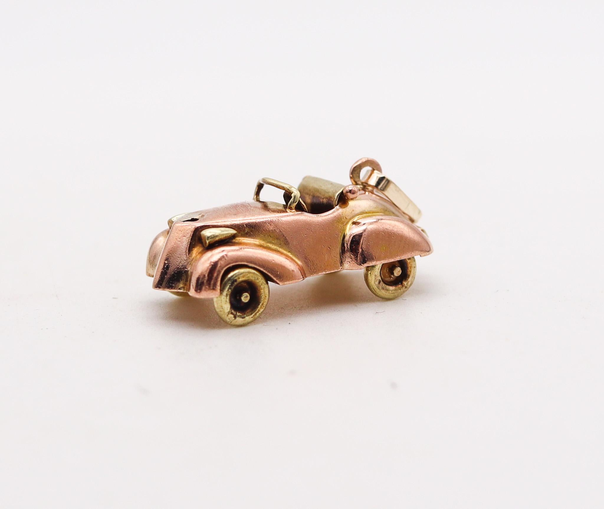 An antique racing car pendant-charm.

Beautiful and very well detailed pendant-charm made in the shape of a racing car. The charm was created during the art deco period back in the 1930's with very nice movable details, such the four wheels. It was