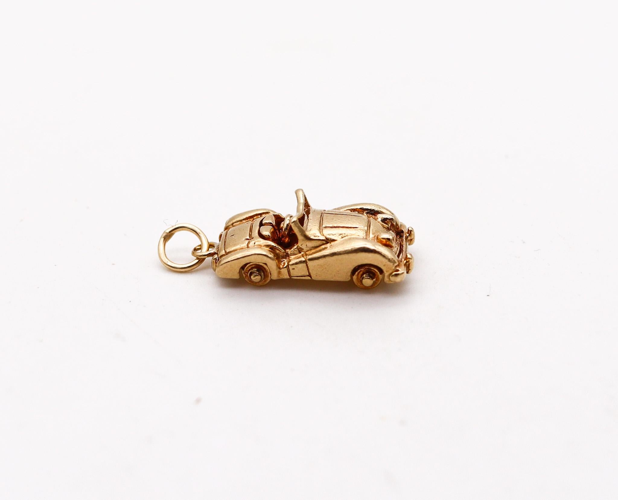 An antique racing car pendant-charm.

Beautiful and very well detailed pendant-charm made in the shape of a racing car. The charm was created during the art deco period back in the 1930's with very nice movable details, such the four wheels. It was