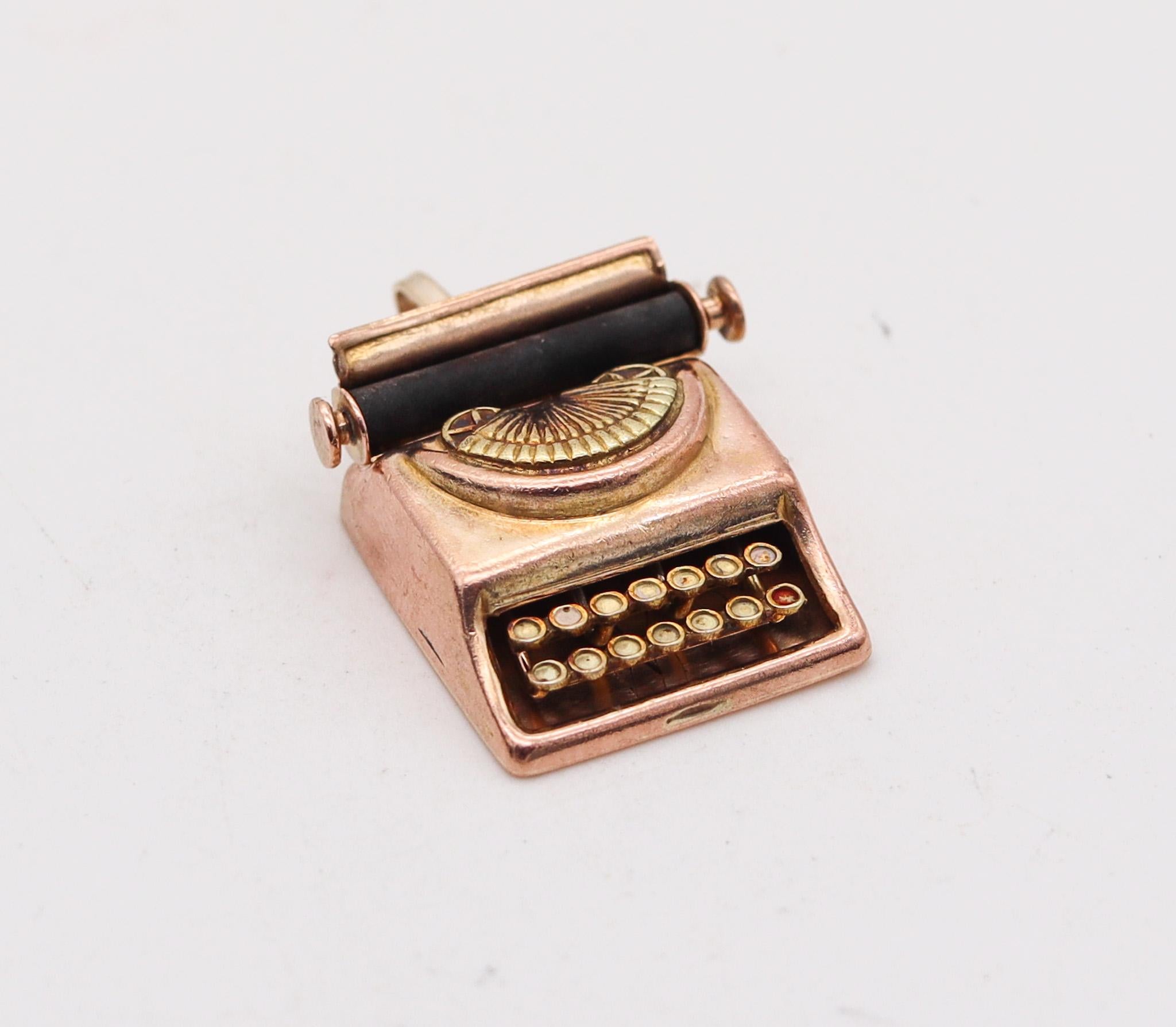 An antique typewriting machine pendant-charm.

Beautiful and very well detailed pendant-charm made in the shape of an early typewriting machine. The charm was created during the art deco period back in the 1930's with very nice movable details such