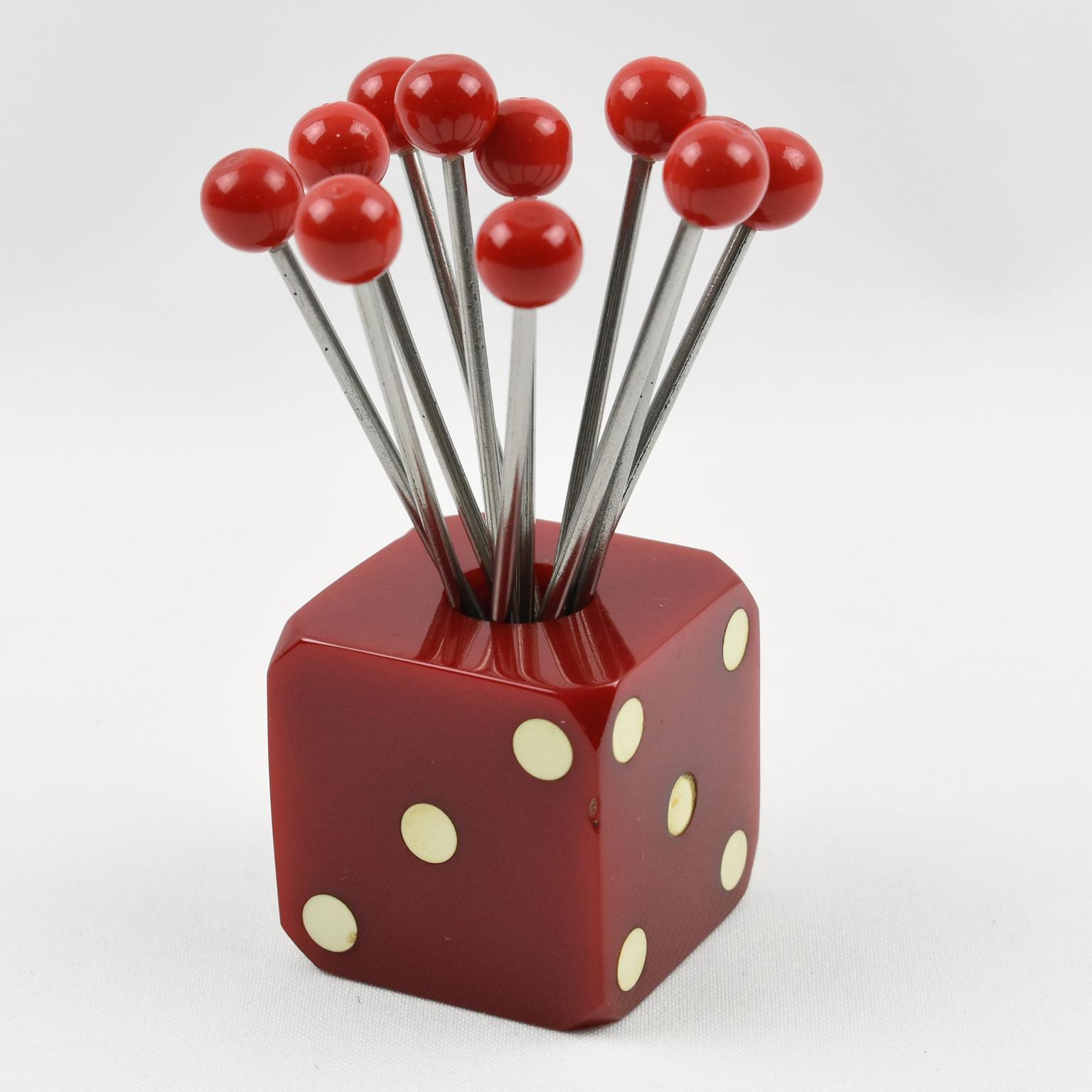 Great looking set of cocktail picks with dice design. Eleven forks with red carved hard plastic bead finial can be removed from central holder and be used as cocktail picks for Manhattan's, Martini's or any other cocktail that requires a garnish.