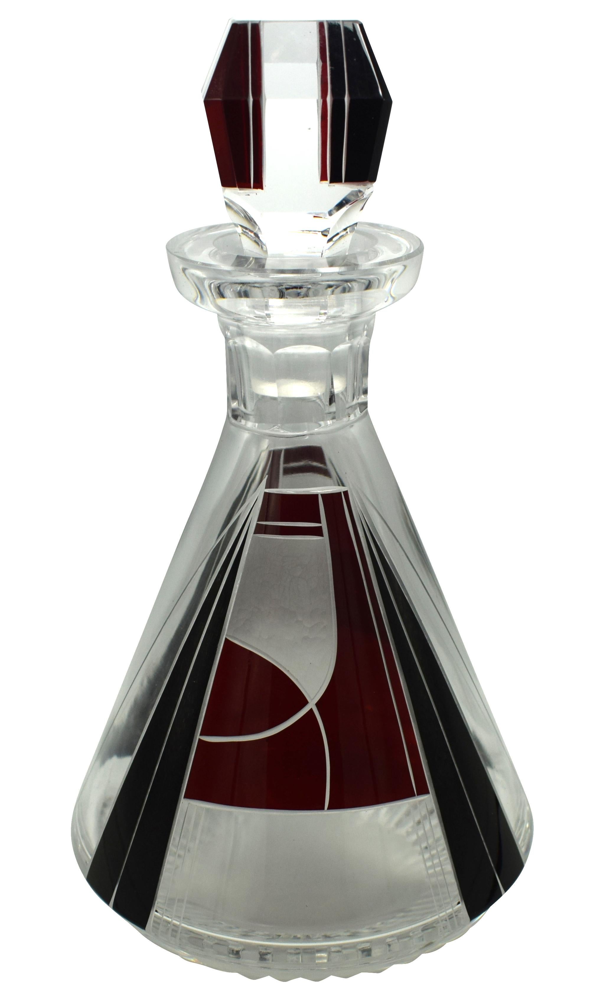 Very stylish and appealing Art Deco decanter set which comes with six matching glasses, and decanter, the whole being heavily enameled with geometric decoration. The colour is a dark red with contrasting jet black accents and the condition is great