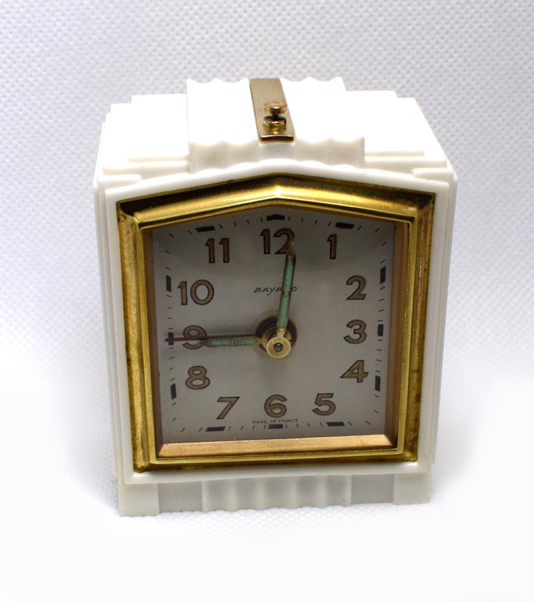 Very attractive 1930s Art Deco French alarm clock in miniature form and in the rare colour way of ivory. These clocks are without doubt very hard to come by in this size and this color, we've only had one in the two years. Not only is this clock
