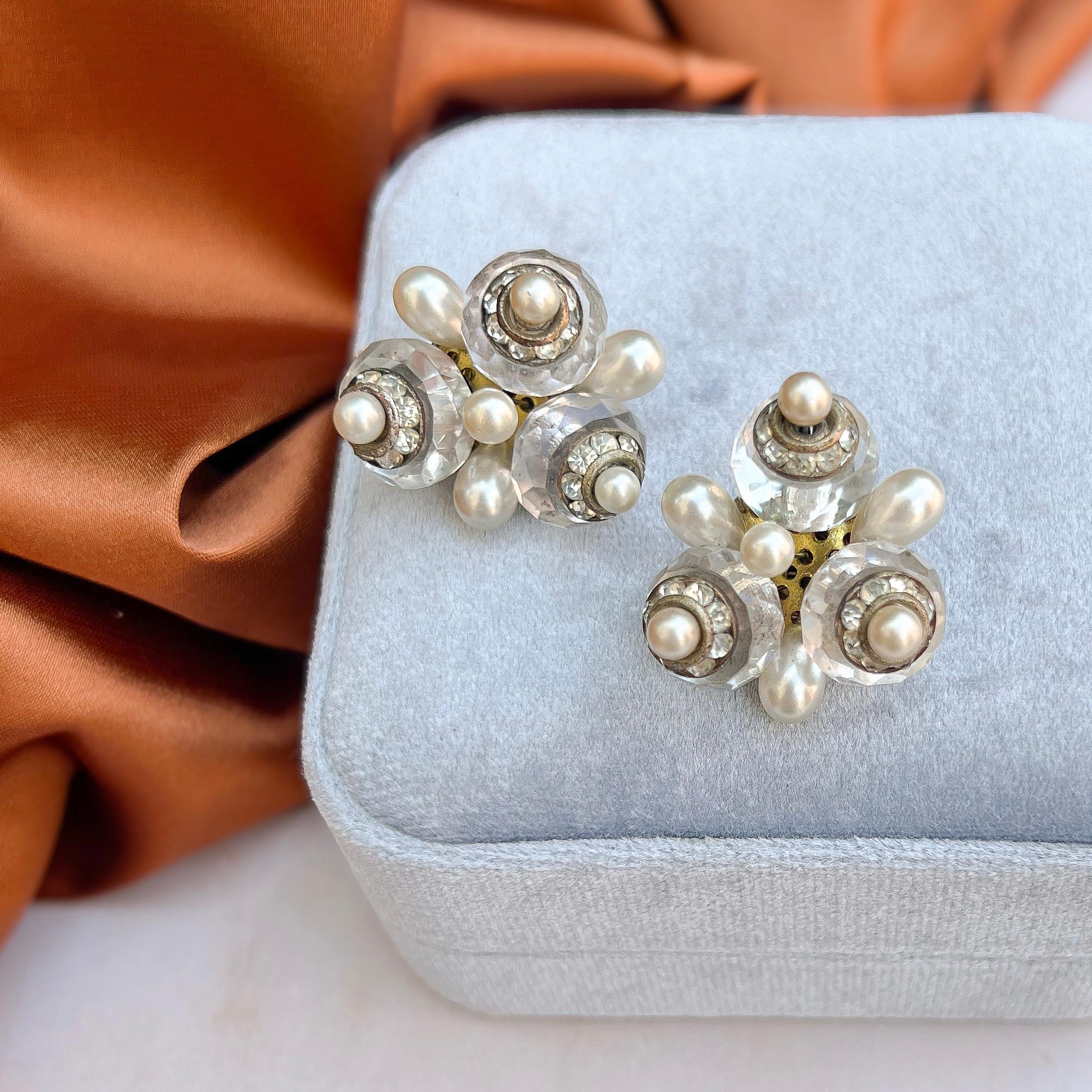 These stylish 1930s earrings were most likely made in France. 

Condition Report:
Very Good - A little tarnishing to the metal reverse of the earrings. This is not visible when the earrings are being worn and does not detract from their appeal.