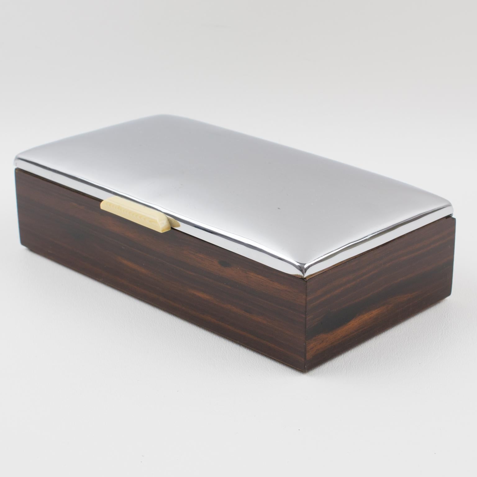 Stylish French Art Deco decorative lidded box. Domed chromed metal lid with a Macassar wood base. Interior in tropical wood. An off-white Galalith handle is on the front. Marked underside: 