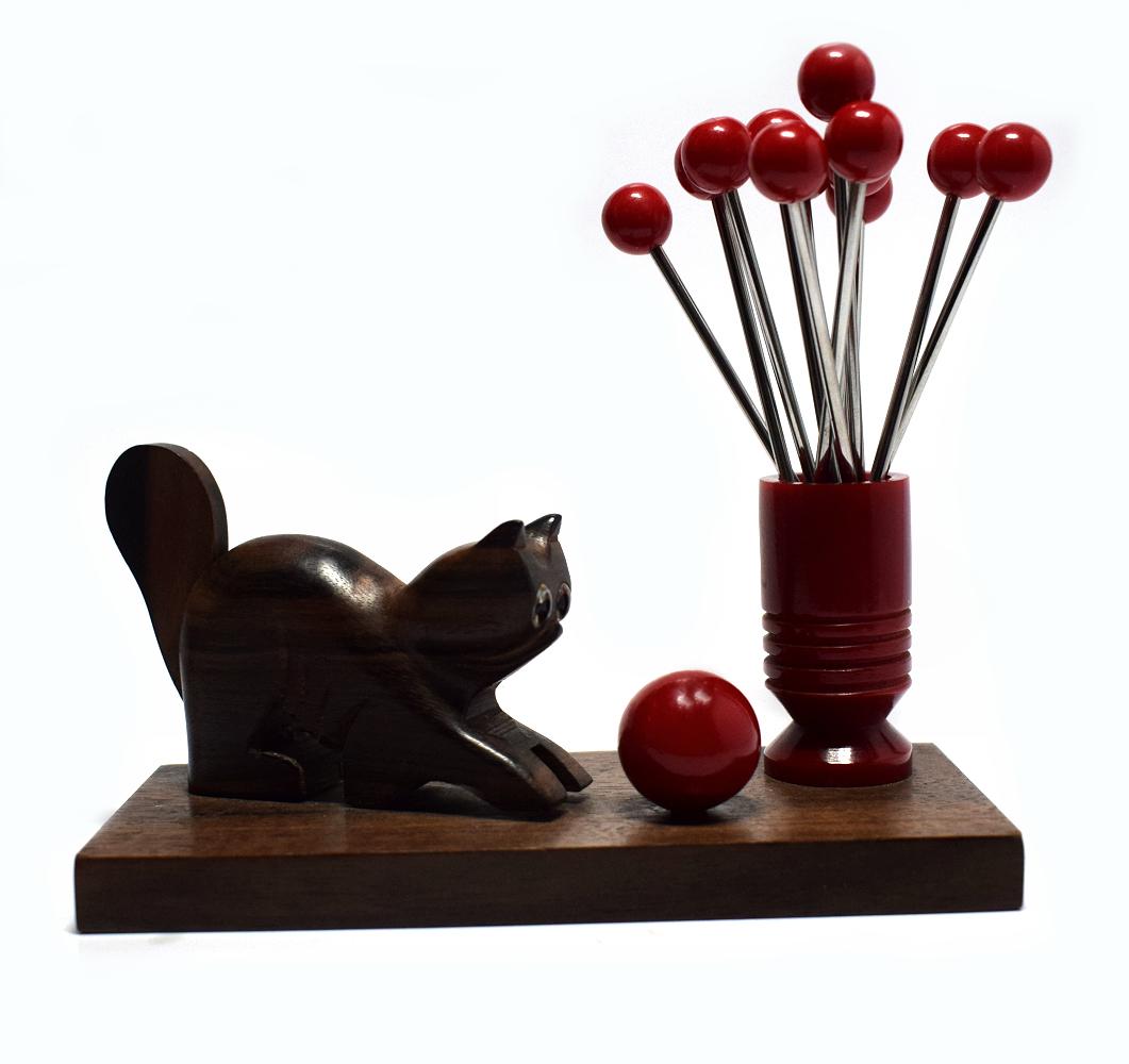Delightful 1930s Art Deco cocktail stick set depicting a playful cat and his ball with twelve cherry red bakelite and chrome cocktail sticks. Originating from France and totally authentic all deco collectors and those with a cocktail bar need one of