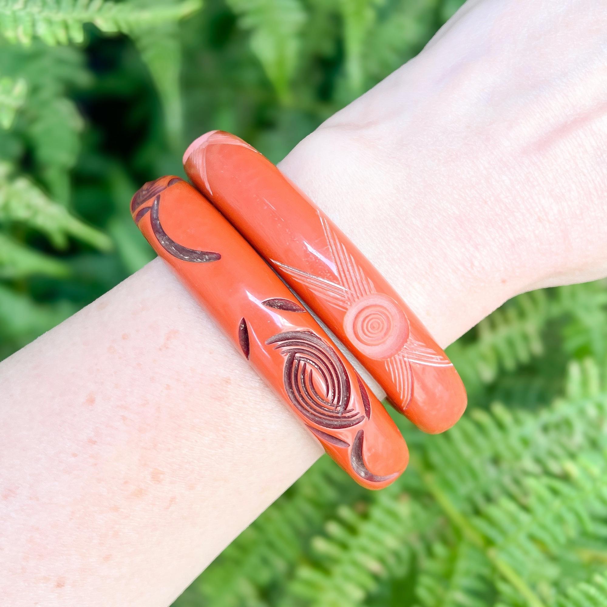 Women's Art Deco 1930s Pair of Vintage Orange Carved Celluloid Bangles For Sale