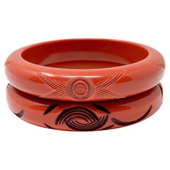 Art Deco 1930s Pair of Vintage Orange Carved Celluloid Bangles