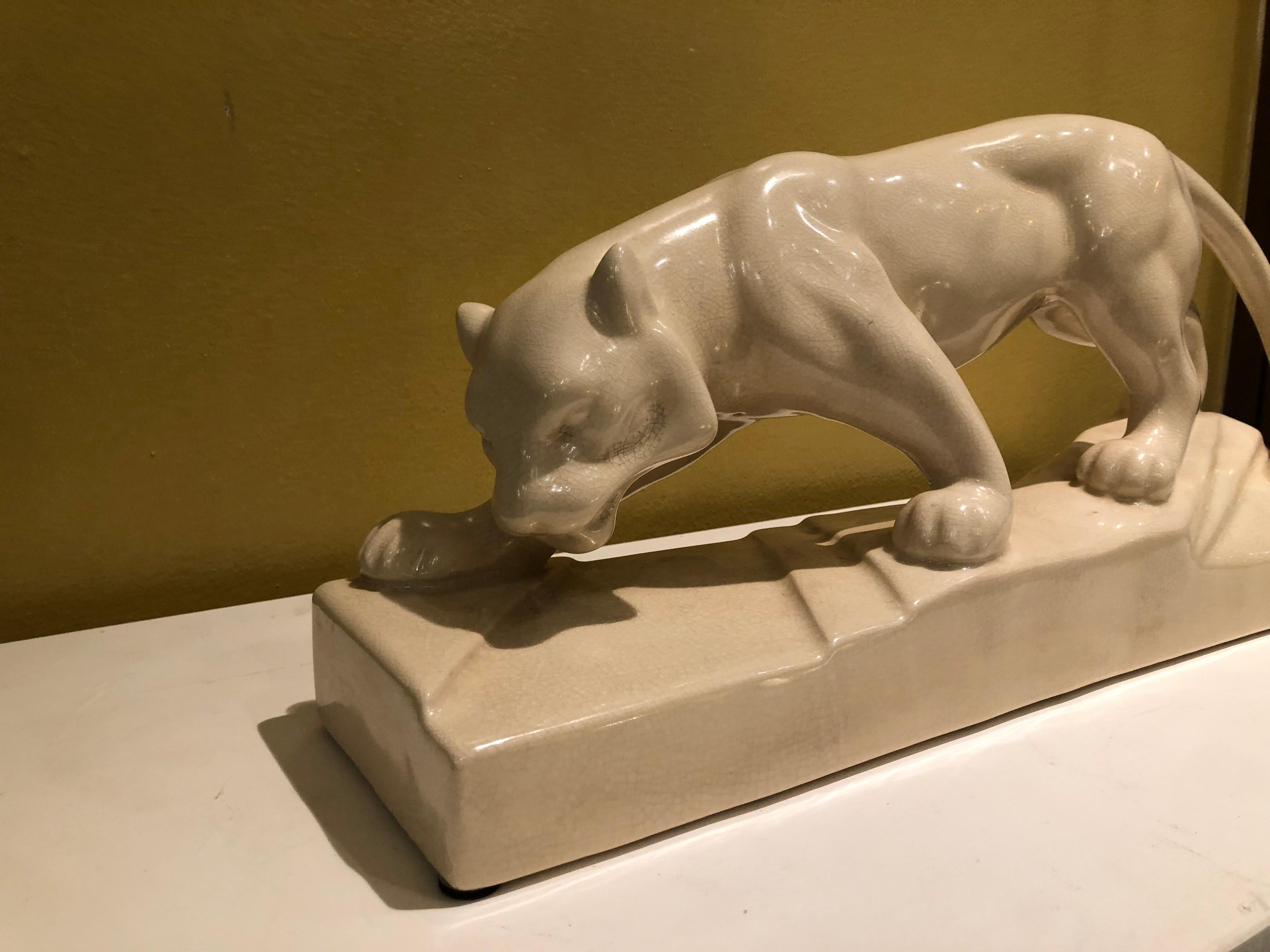 Ivory white ceramic Art Deco sculpture depicting a panther, France, circa 1930. Excellent conditions. A video is available on request. Measures: W 50 x D 13 x H 25 cm.