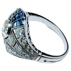 Vintage Art Deco 1930s Ring Brilliant Cut Diamond 0.65 Cts and Sapphire Platinum